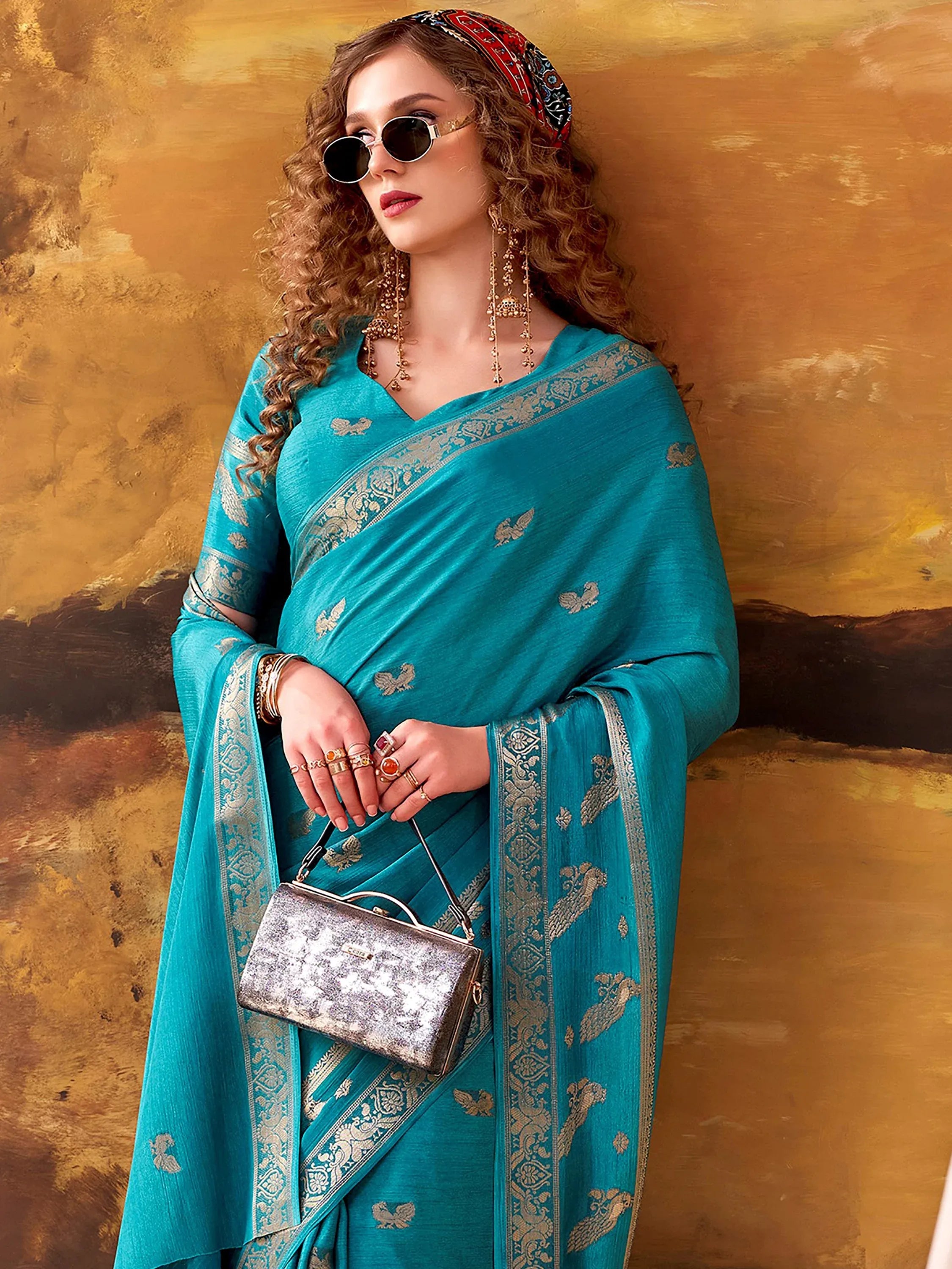 Ravishing Teal Blue Zari Weaving Crepe Casual Wear Saree With Blouse
