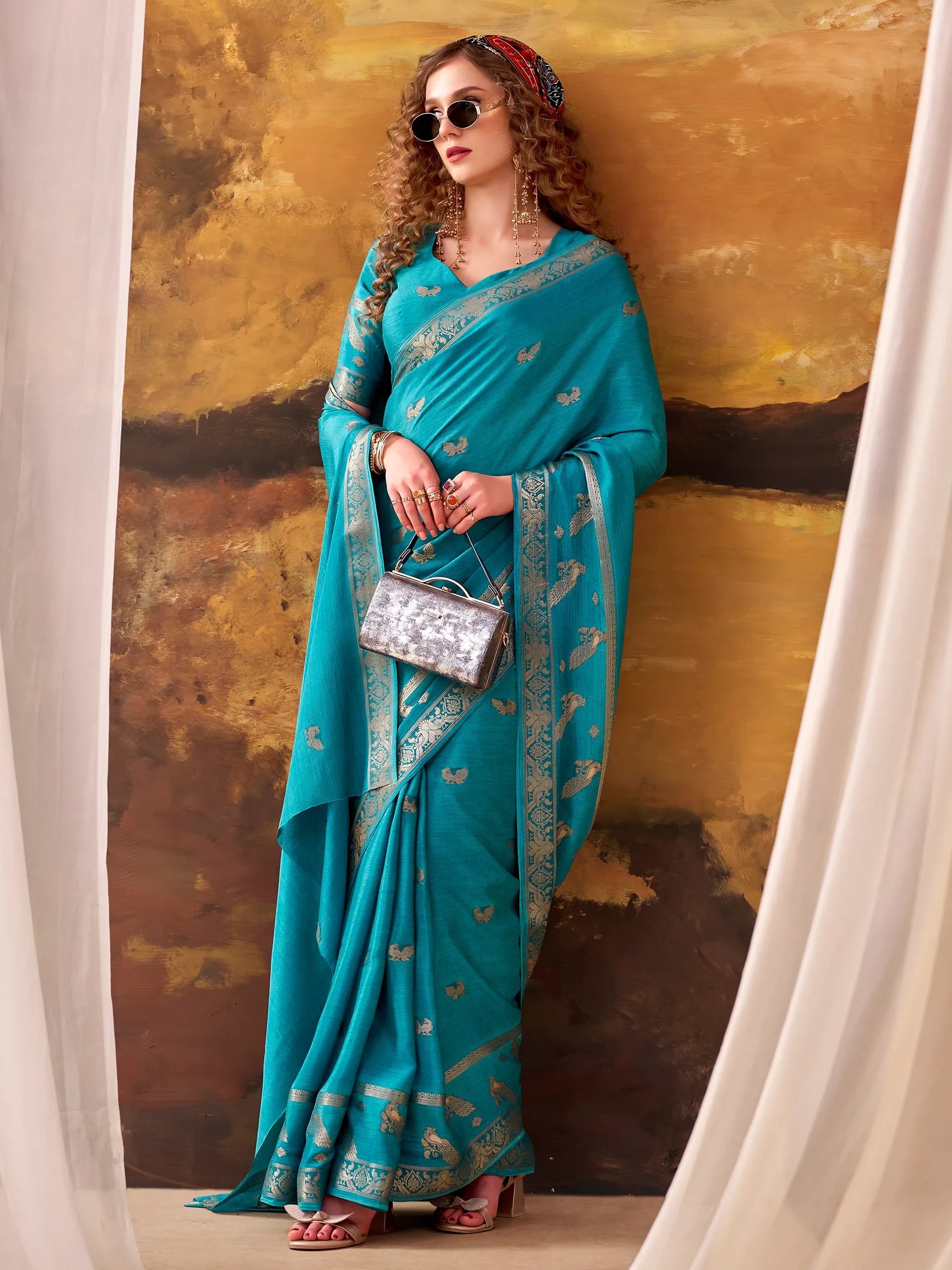 Ravishing Teal Blue Zari Weaving Crepe Casual Wear Saree With Blouse