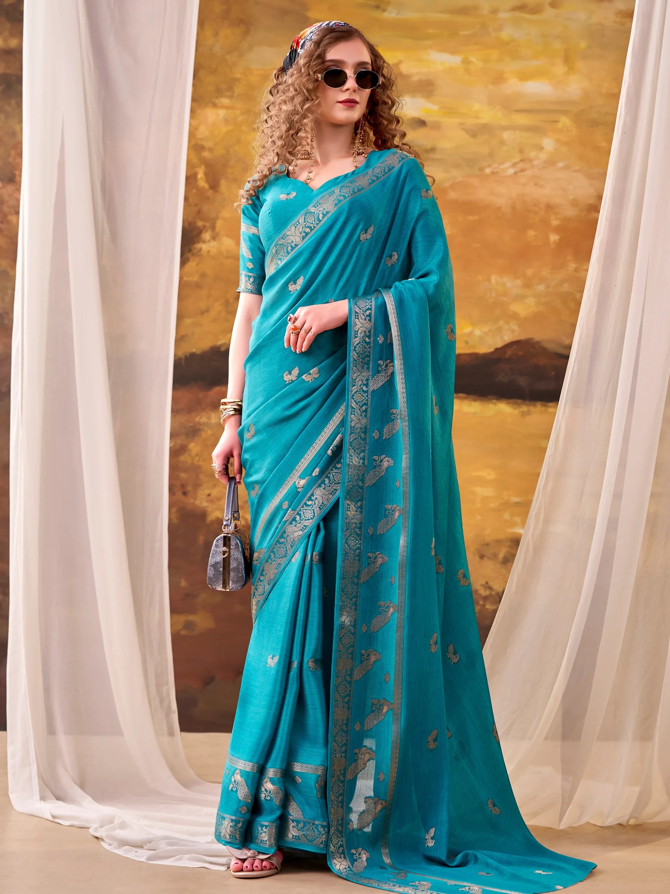 Ravishing Teal Blue Zari Weaving Crepe Casual Wear Saree With Blouse