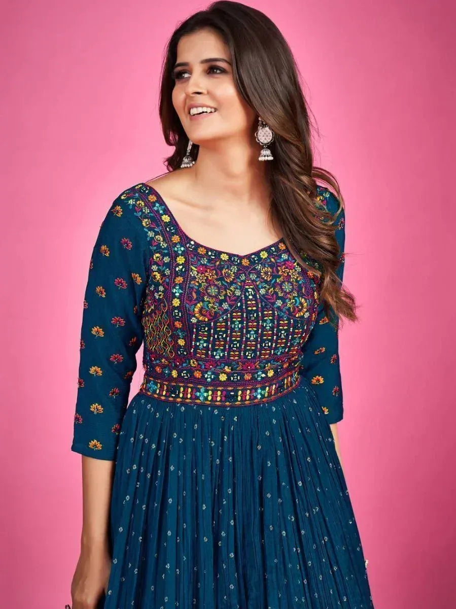 Teal embroidered ethnic gown with floral motifs and pleated skirt, perfect for Indian occasions