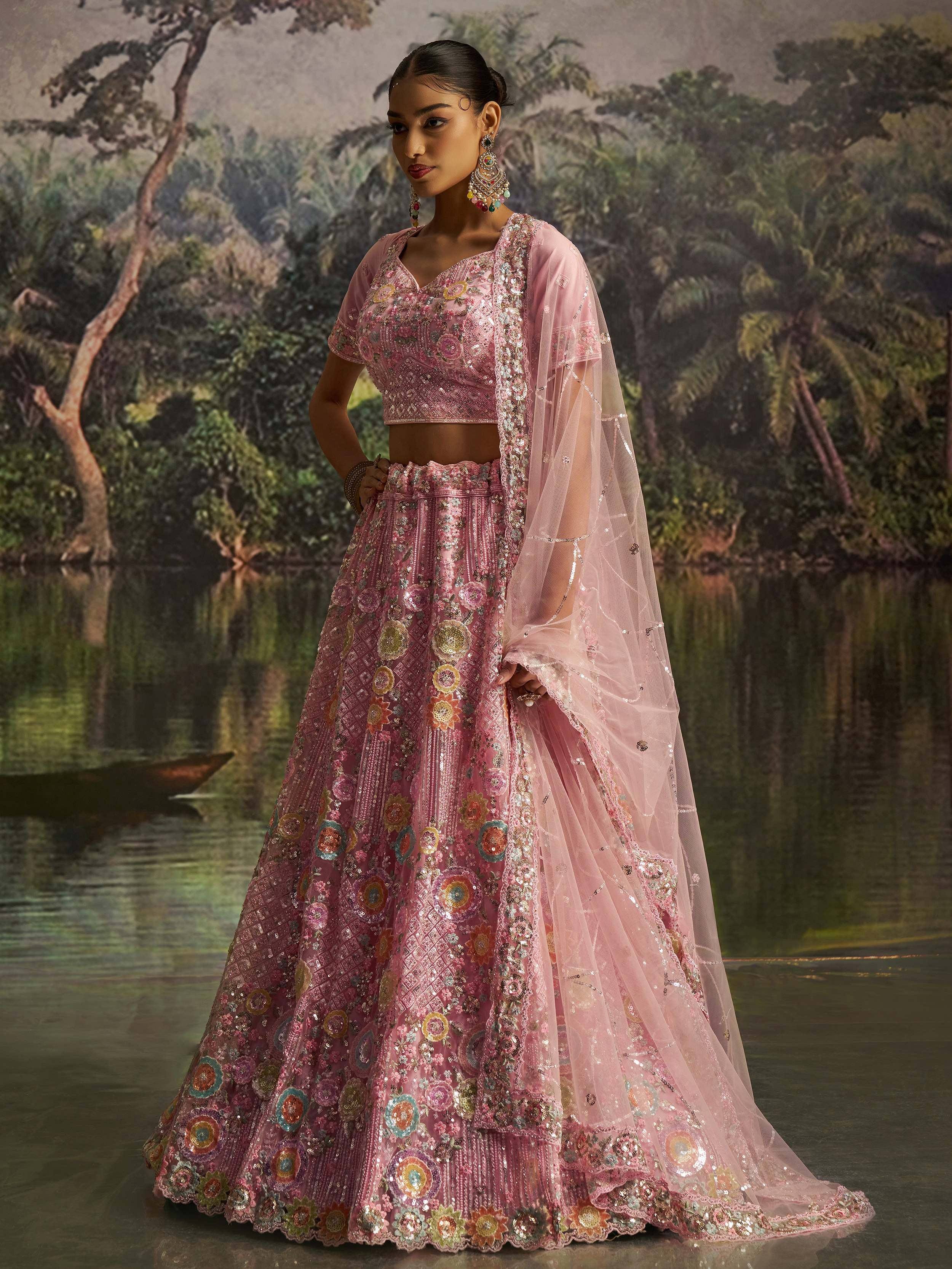 Pink embroidered lehenga choli with floral motifs and sheer dupatta, perfect for Indian ethnic occasions