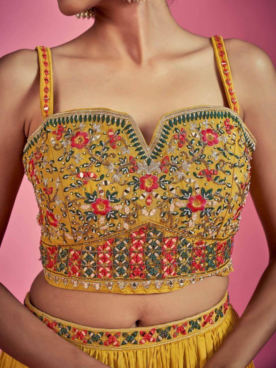 Yellow embroidered lehenga choli top with floral mirror work, perfect for Indian ethnic wear