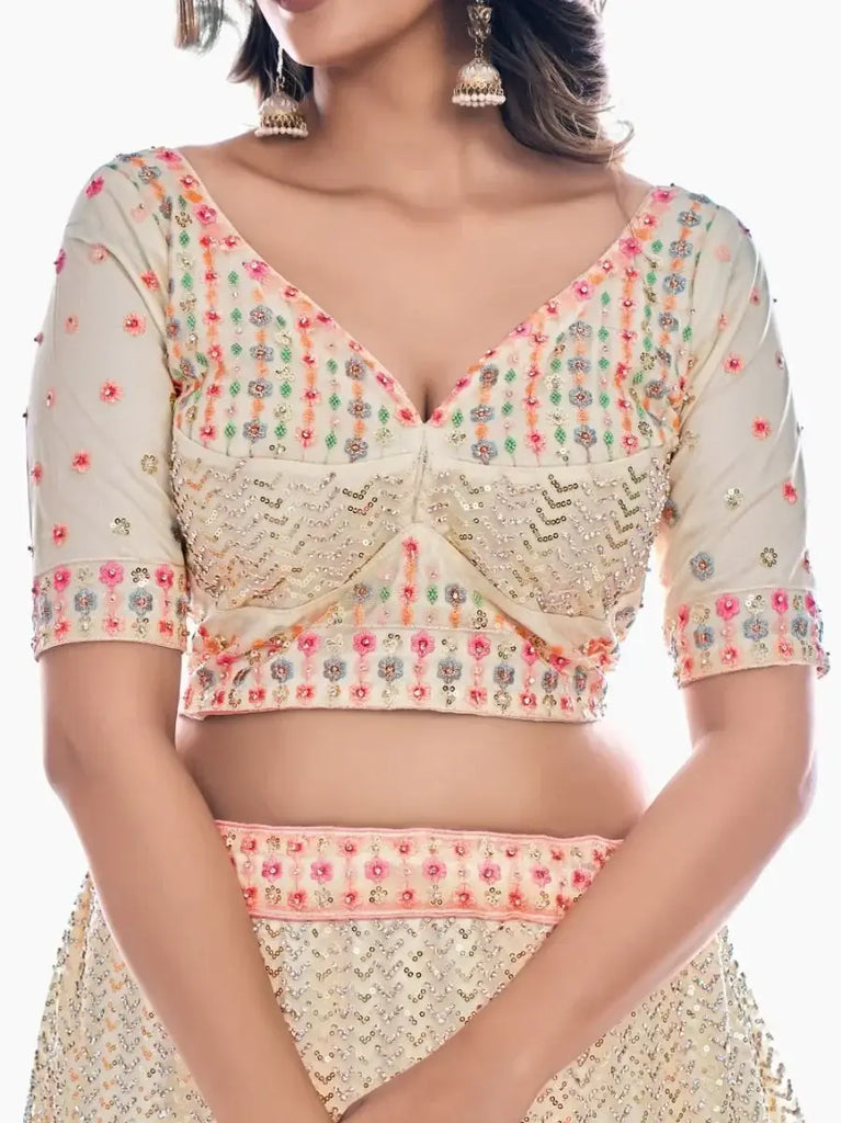 Fluorescent Off-White Embroidered Soft Net Lehenga Choli