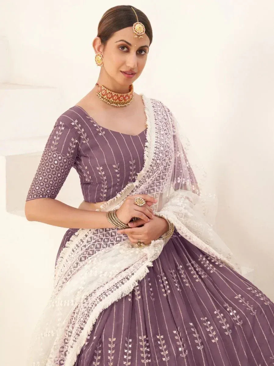 Purple embroidered lehenga choli with white dupatta, traditional Indian ethnic wear for women