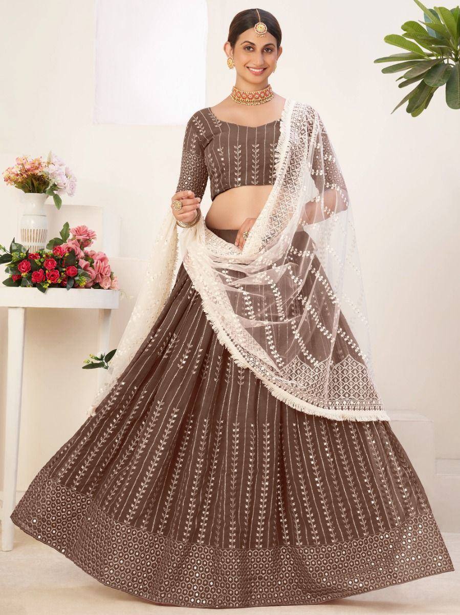 Brown embroidered lehenga choli with white dupatta, perfect for Indian ethnic wear occasions
