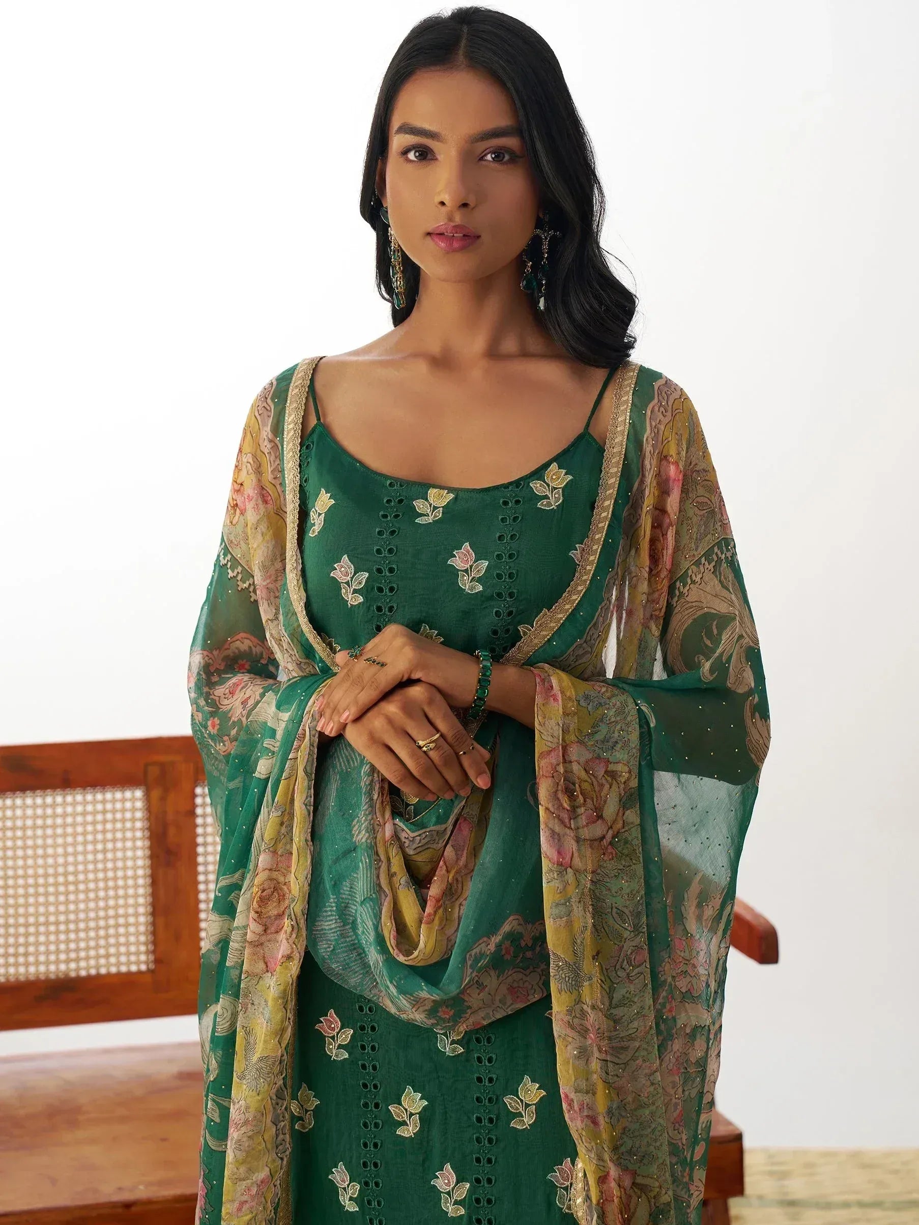 Emerald green embroidered ethnic gown with floral dupatta, perfect for Indian occasions and festive wear.