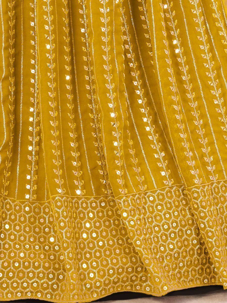 Mustard yellow ethnic lehenga with gold leaf embroidery and mirror work detail