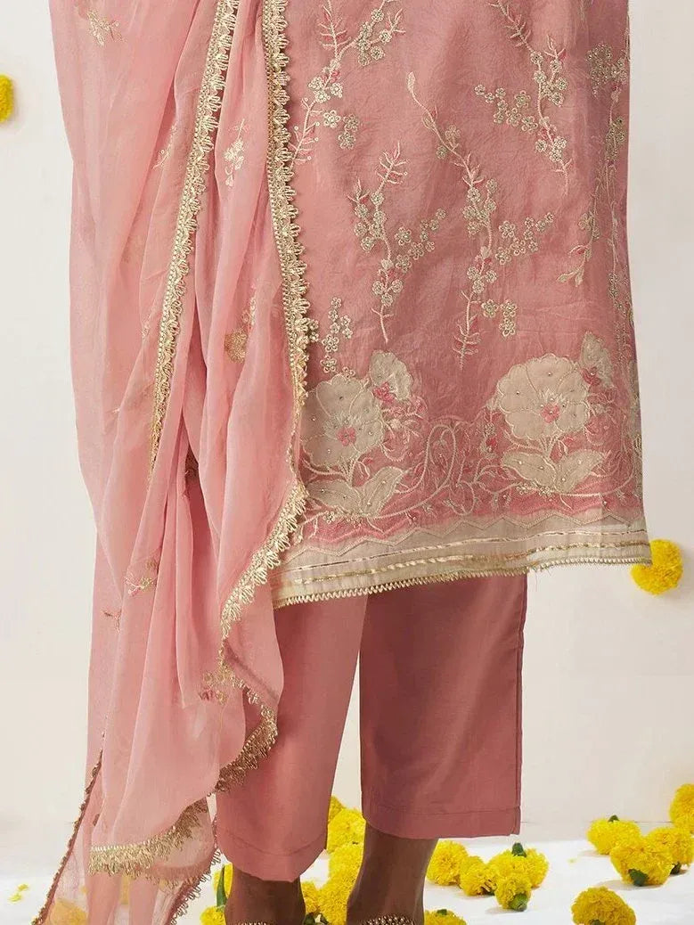 Pink embroidered salwar kameez with floral gold detailing and matching dupatta, ideal for ethnic occasions