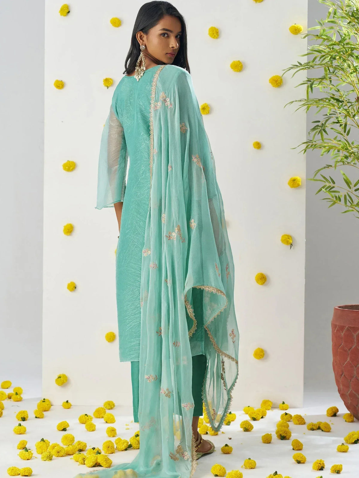 Mint green embroidered salwar kameez with sheer dupatta, perfect for ethnic occasions and festive wear.