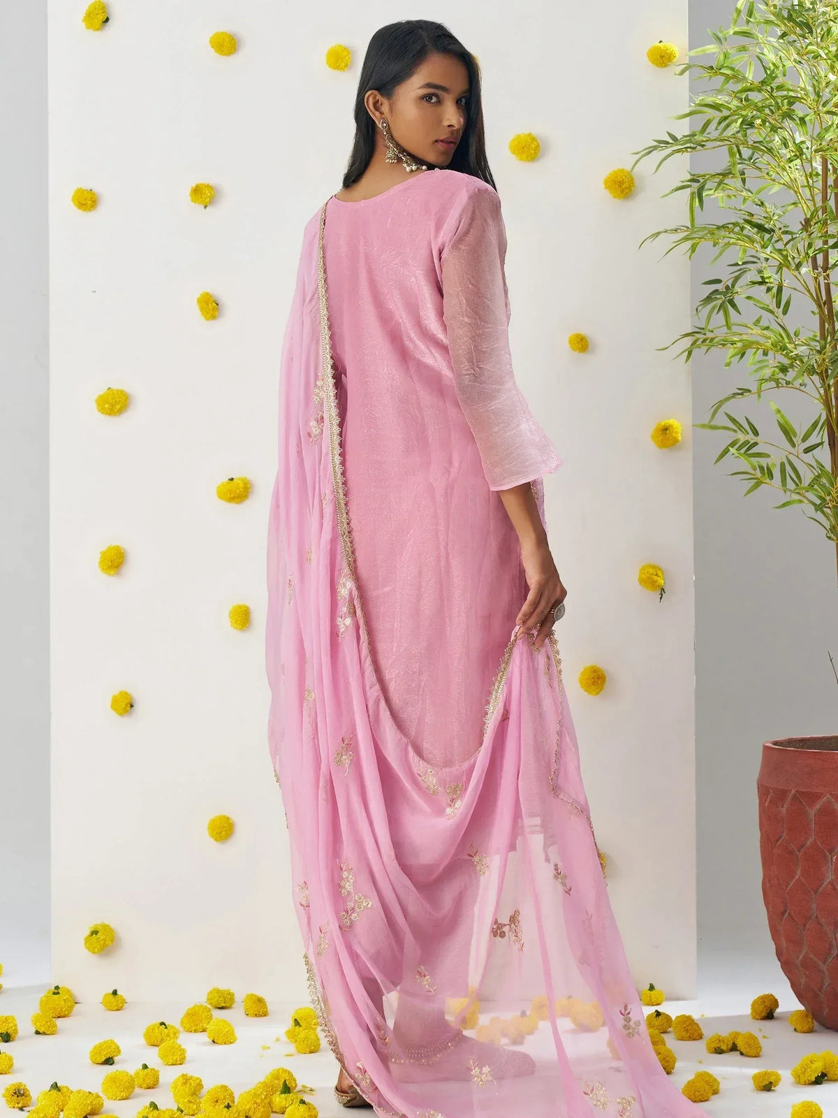 Pink ethnic salwar kameez with gold embroidery, perfect for Indian festive occasions and weddings.