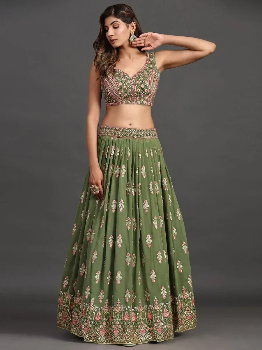 Olive green embroidered lehenga choli with floral motifs, perfect for Indian ethnic wear occasions.