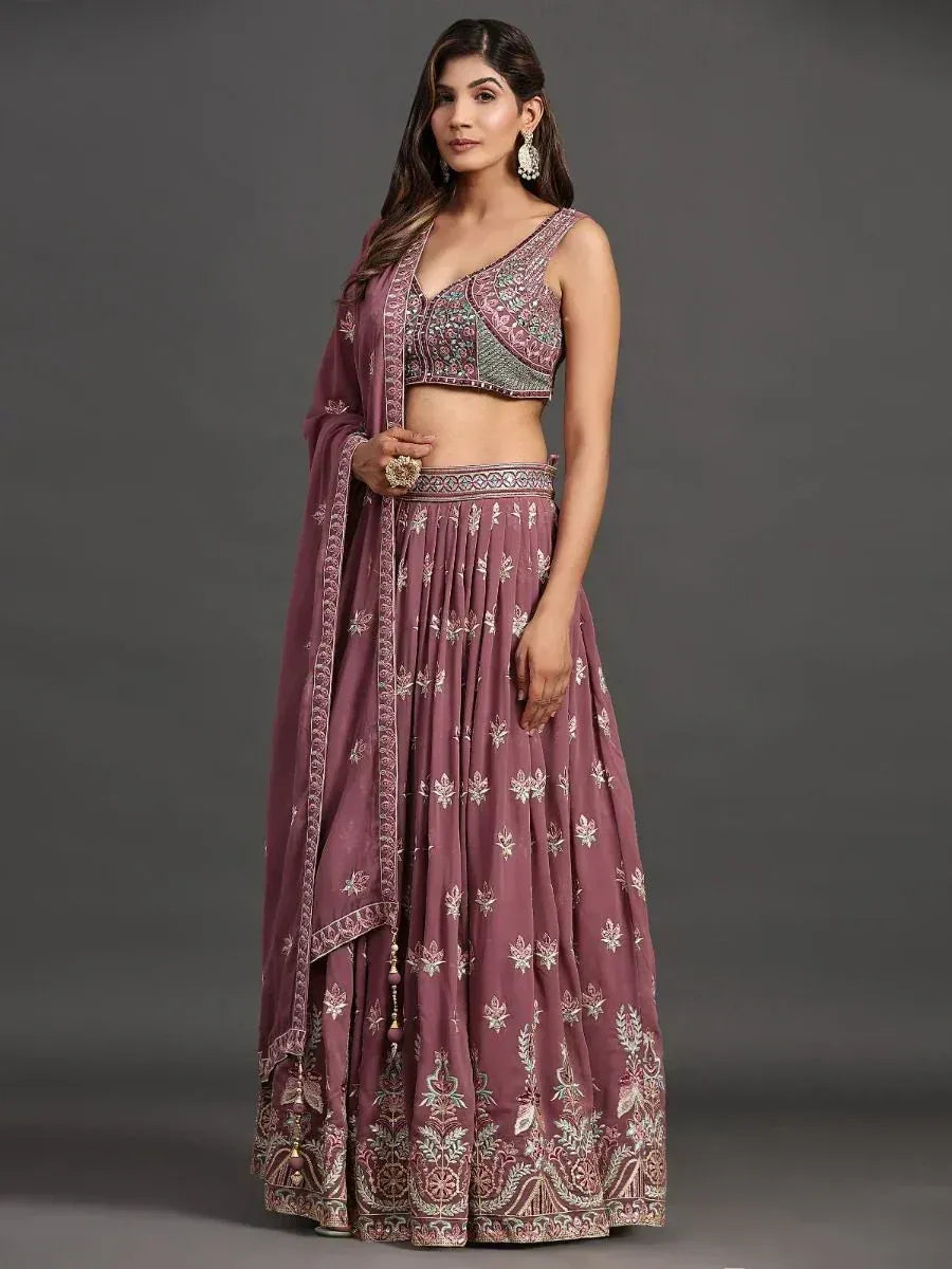 Elegant mauve lehenga choli with intricate floral embroidery, perfect for Indian ethnic occasions.