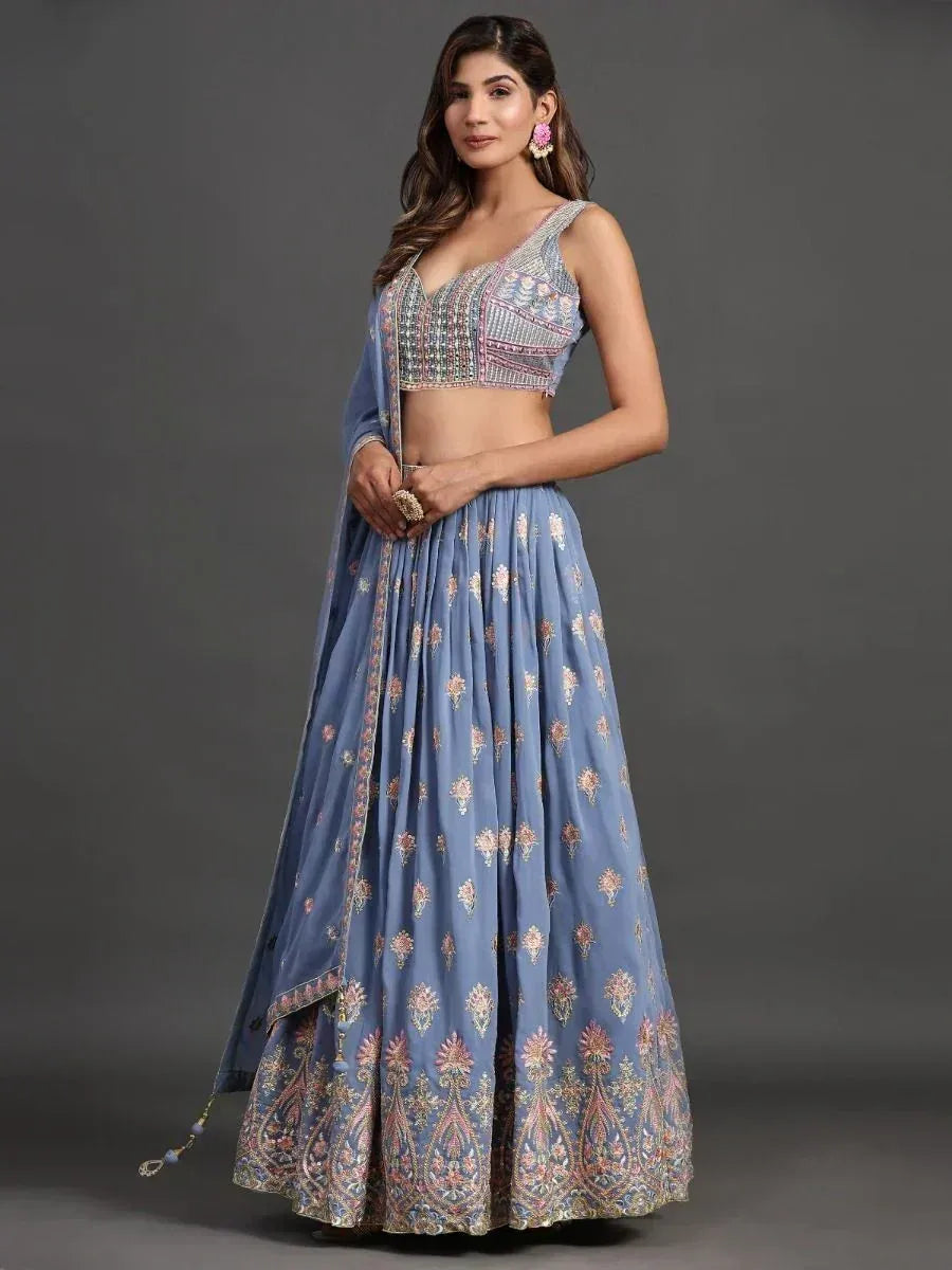 Blue embroidered lehenga choli with floral motifs and matching dupatta, perfect for Indian ethnic occasions