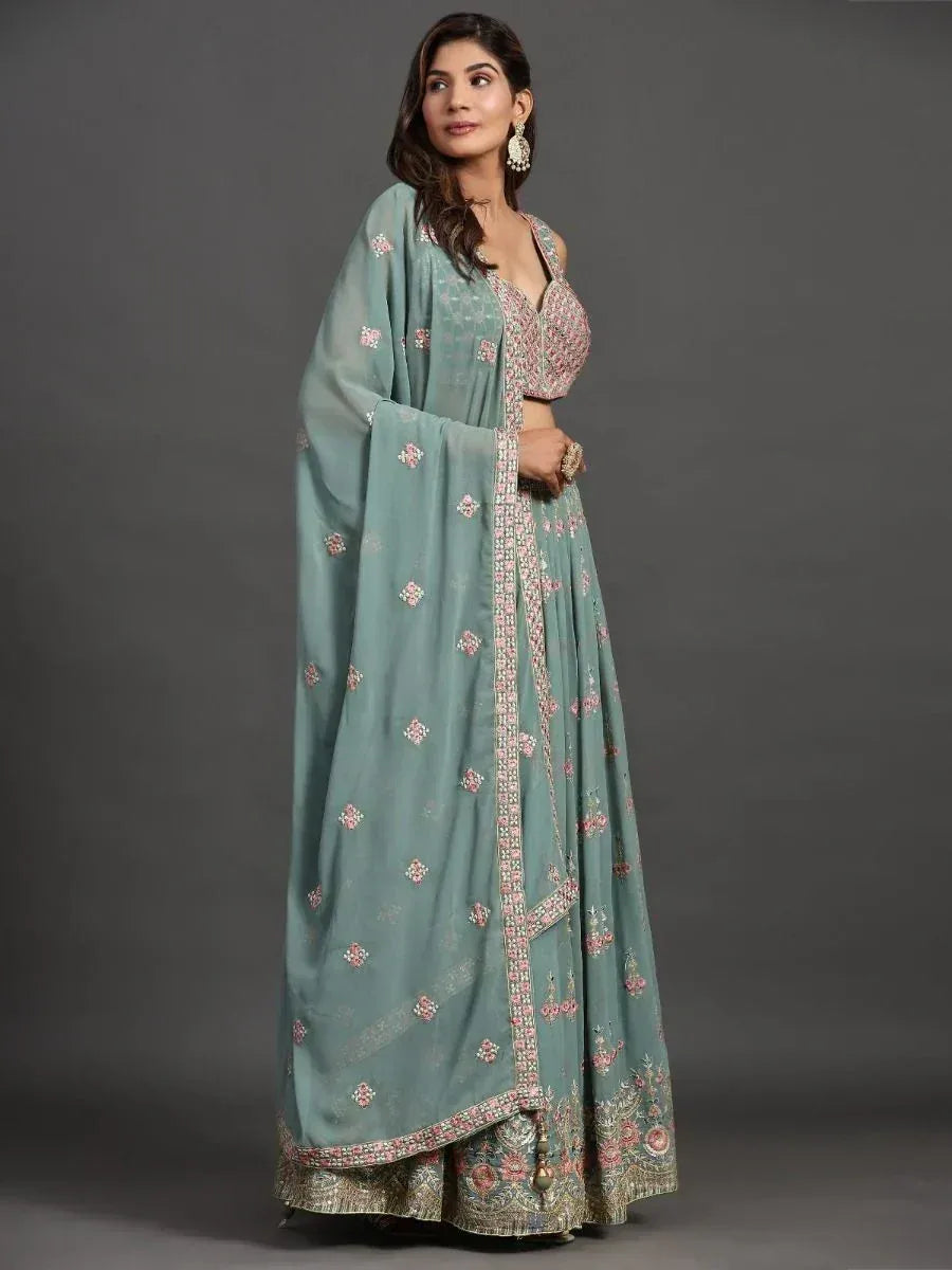 Elegant mint green lehenga choli with floral embroidery and dupatta, perfect for Indian ethnic occasions
