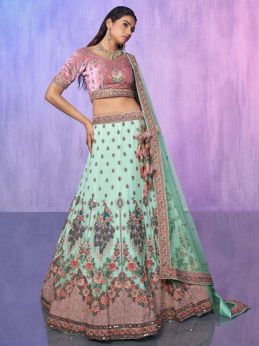 Mint green lehenga choli with floral embroidery and peacock motifs, perfect for Indian ethnic wear occasions