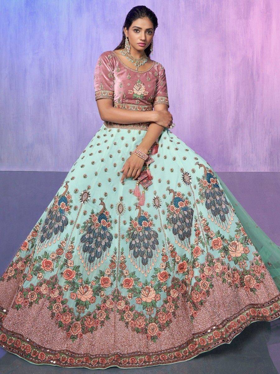 Pink and mint green designer lehenga choli with peacock and floral embroidery, perfect for Indian ethnic occasions