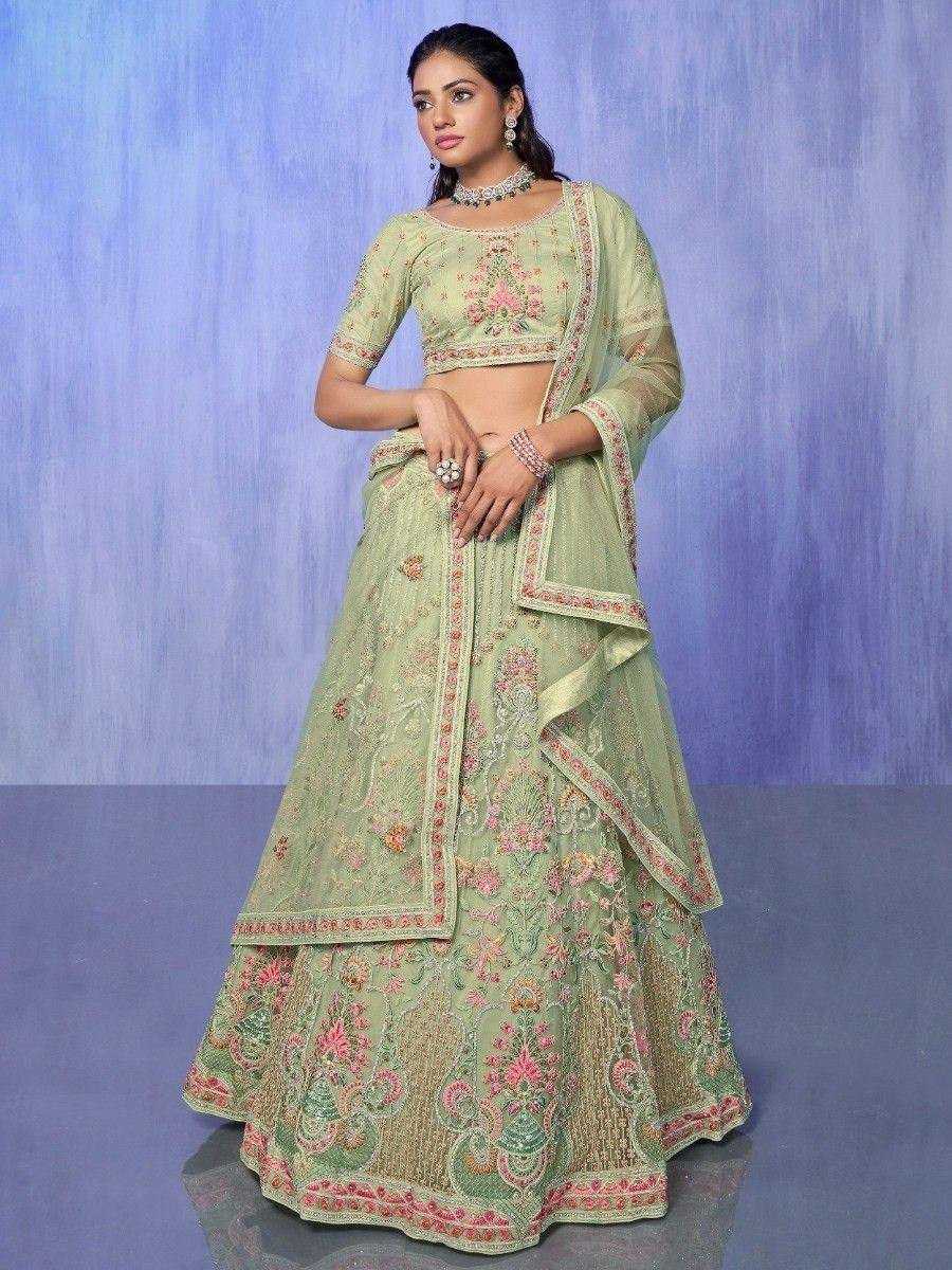 Mint green embroidered lehenga choli with floral motifs, perfect for Indian ethnic wear occasions.