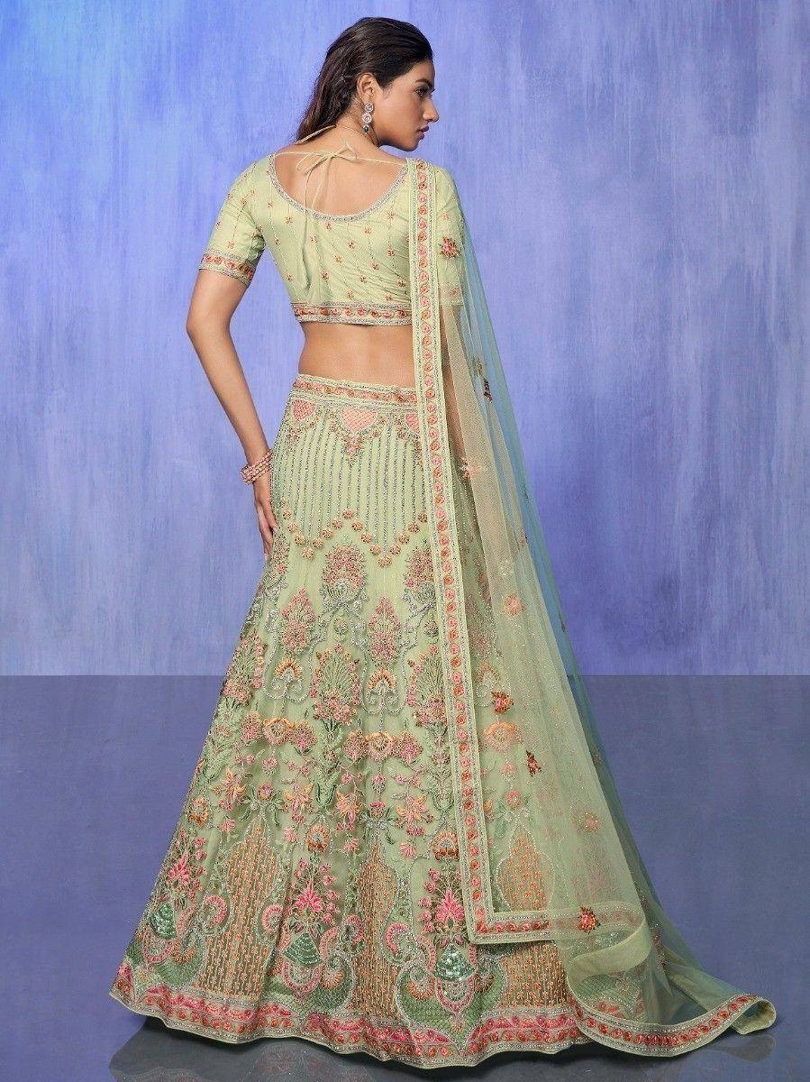 Light green embroidered lehenga choli with floral motifs and sheer dupatta, perfect for Indian ethnic occasions.