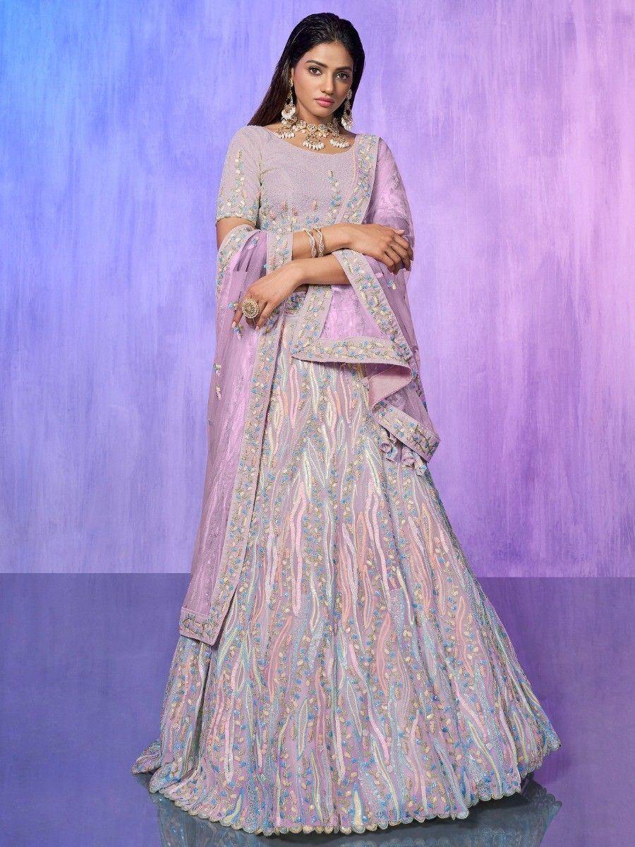 Elegant lavender lehenga choli with intricate embroidery, perfect for Indian weddings and festive occasions.