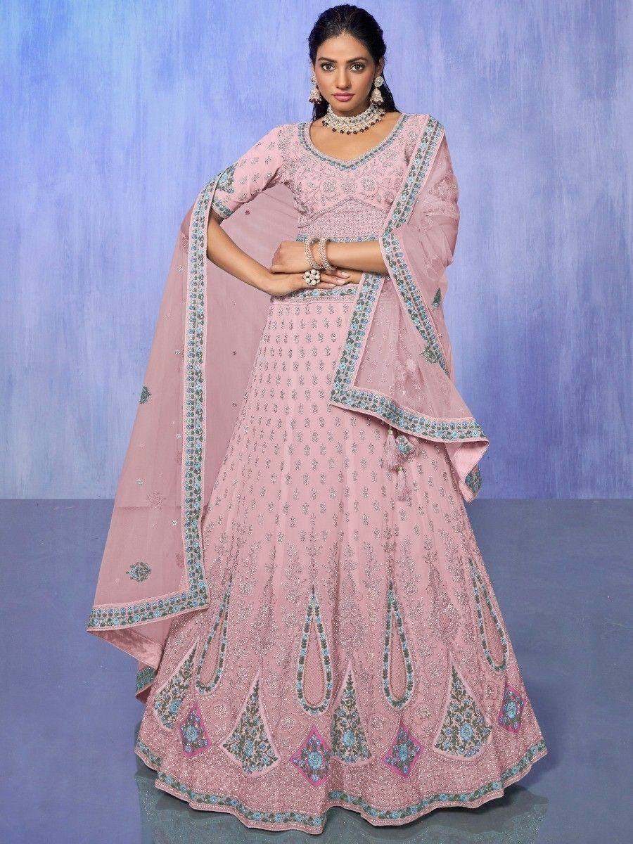 Pink embroidered lehenga choli with blue-green border, perfect for Indian weddings and festive occasions