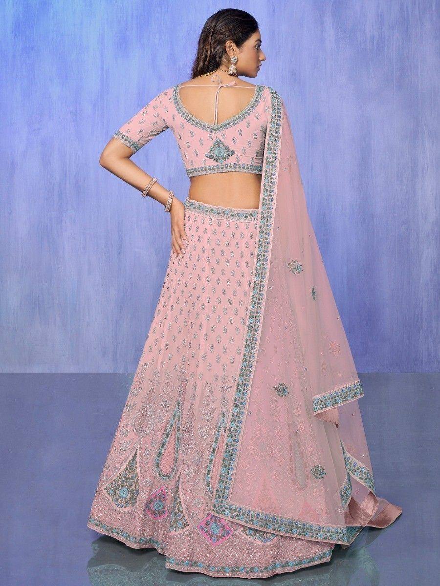 Pink embroidered lehenga choli with blue detailing, perfect for Indian ethnic wear events