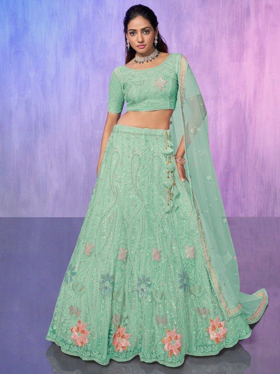 Mint green embroidered lehenga choli with floral motifs and sheer dupatta, perfect for Indian ethnic occasions.