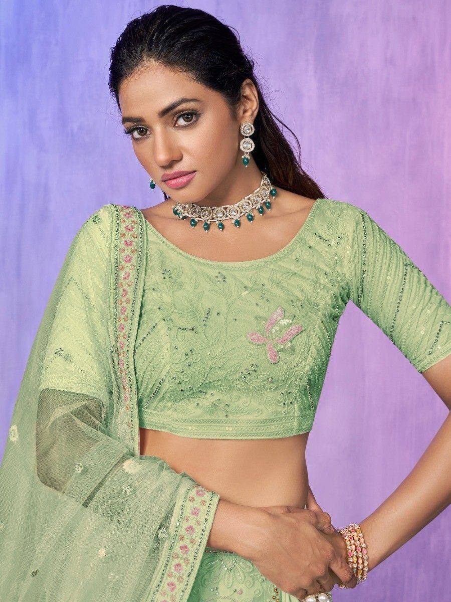 Mint green embroidered lehenga choli with floral detailing and matching dupatta, perfect for Indian ethnic wear.