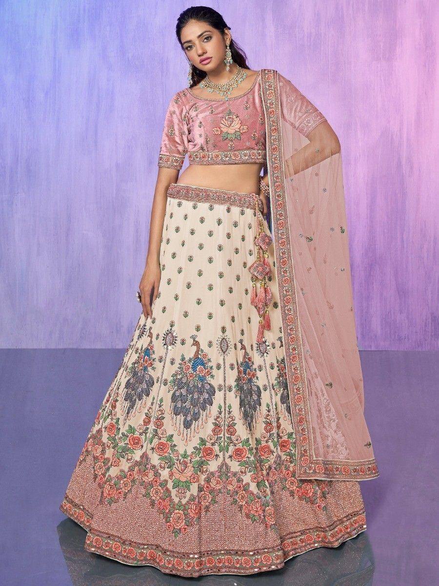 Pink and cream floral embroidered lehenga choli with peacock motifs and matching dupatta for Indian ethnic wear