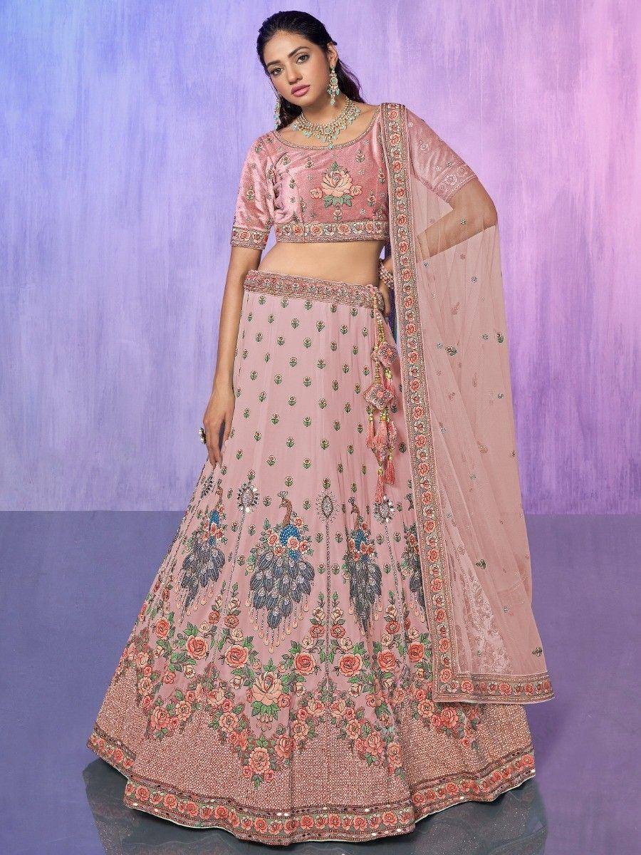 Pink embroidered lehenga choli with floral and peacock motifs, perfect for Indian ethnic wear occasions