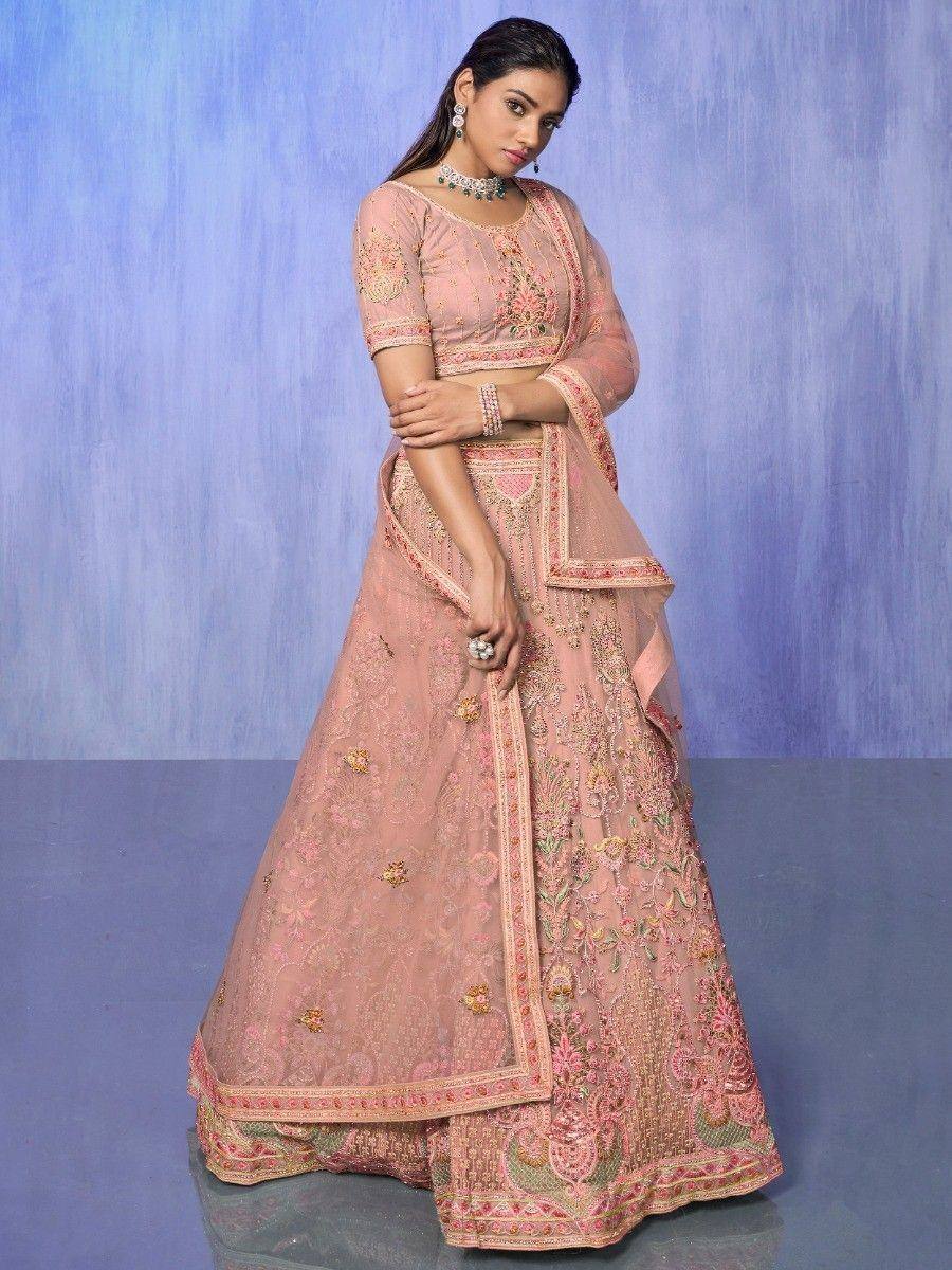 Pink embroidered lehenga choli with floral motifs, perfect for Indian weddings and festive occasions