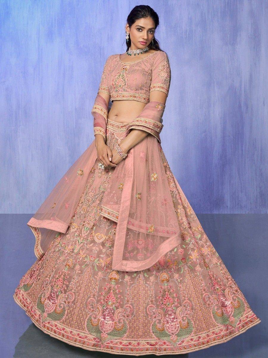 Pink embroidered lehenga choli with floral motifs, perfect for Indian weddings and festive occasions
