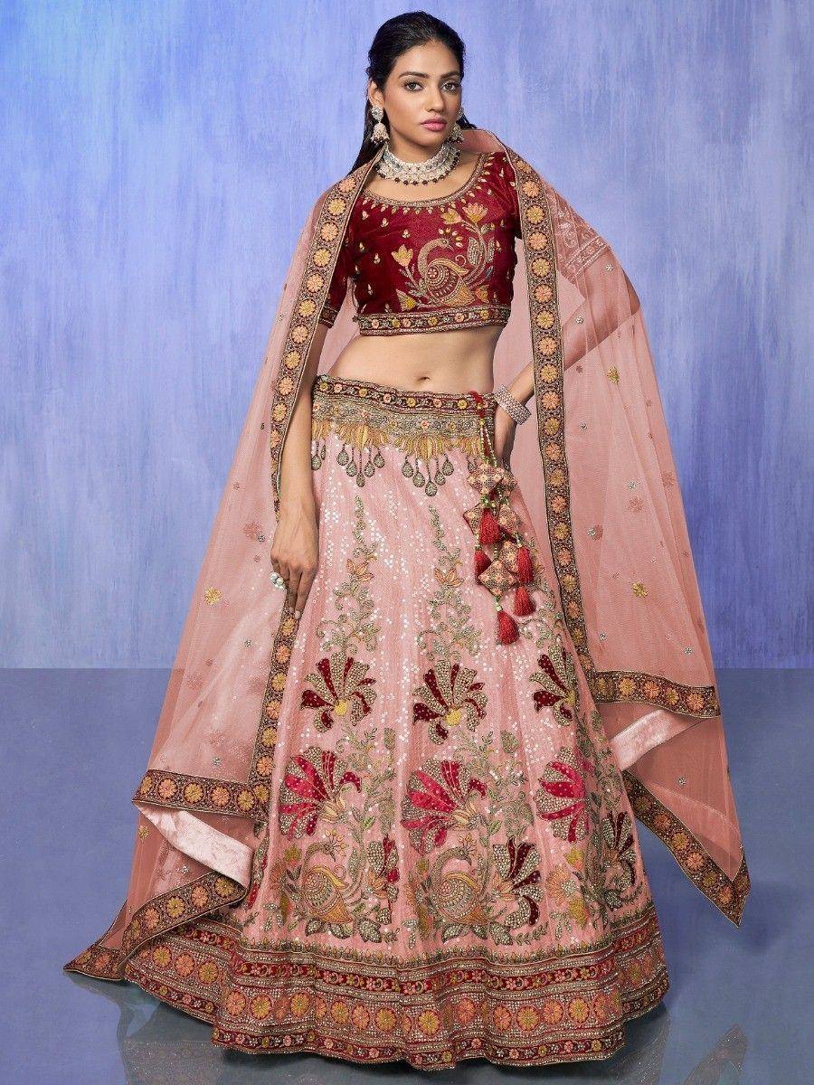 Pink and maroon embroidered lehenga choli with floral motifs and dupatta, ideal for Indian weddings and festive occasions