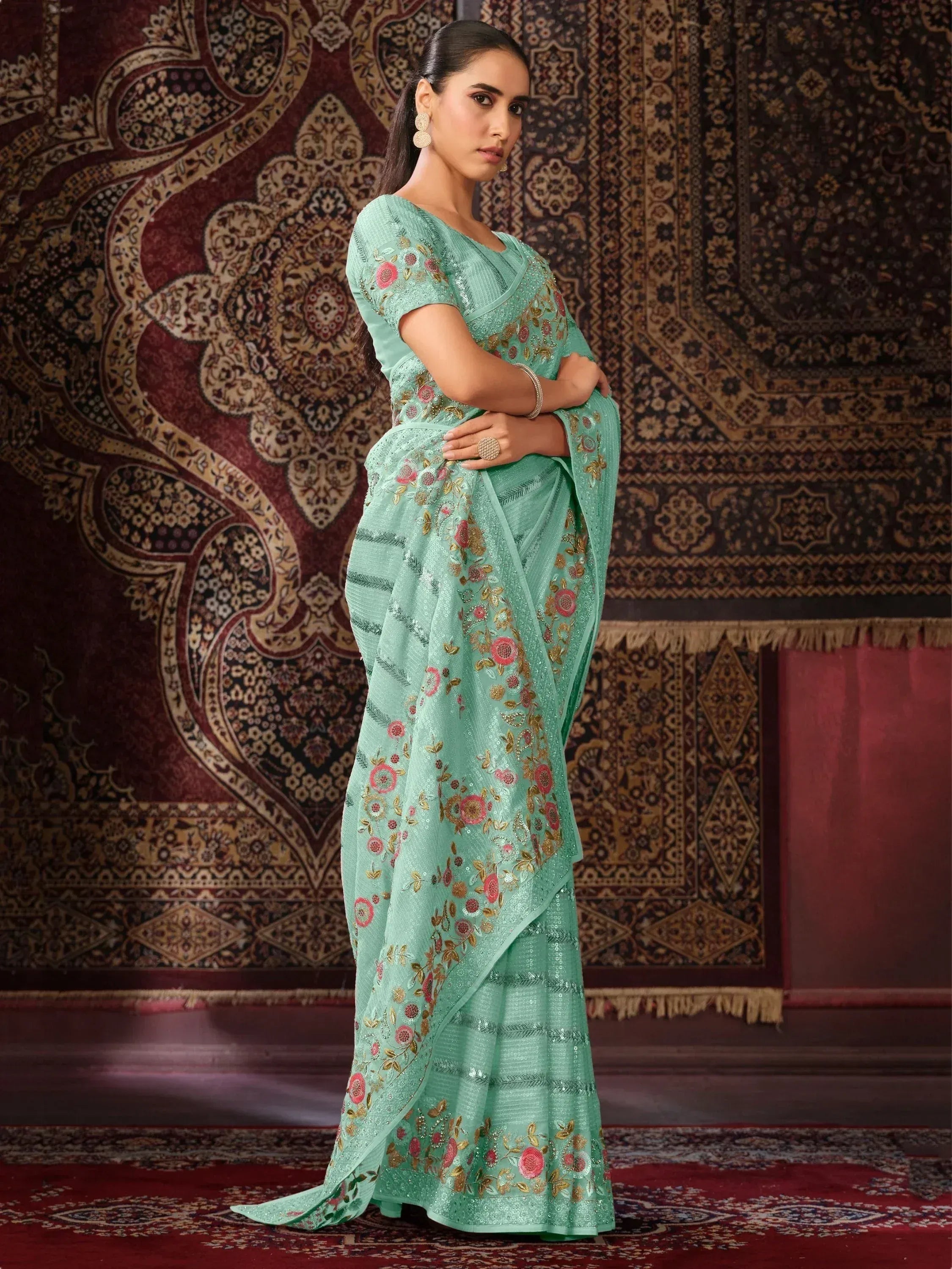 Mint green embroidered saree with floral sequin work, perfect for Indian ethnic occasions.