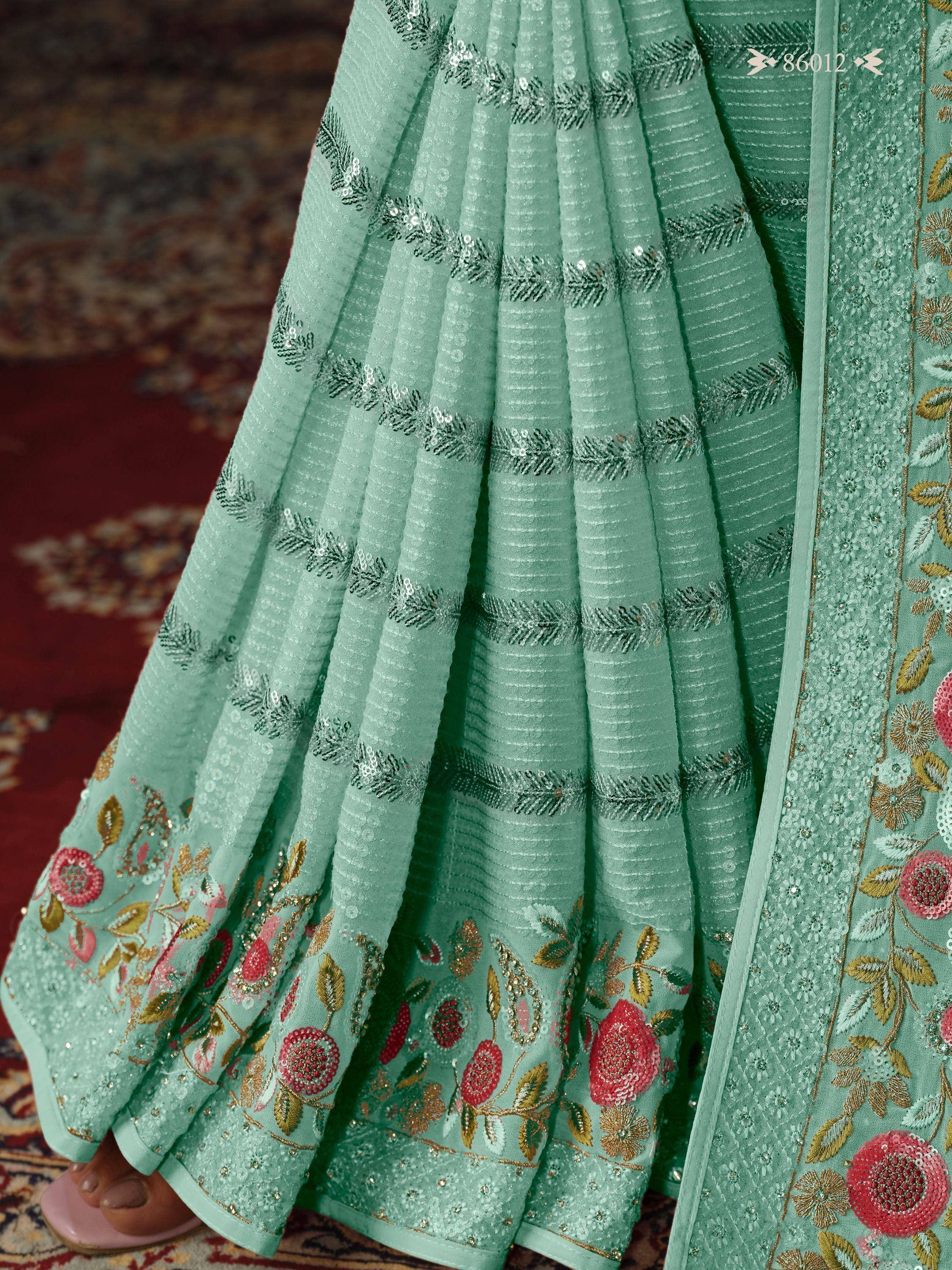 Mint green designer lehenga with floral embroidery and sequin work, perfect for Indian ethnic wear.