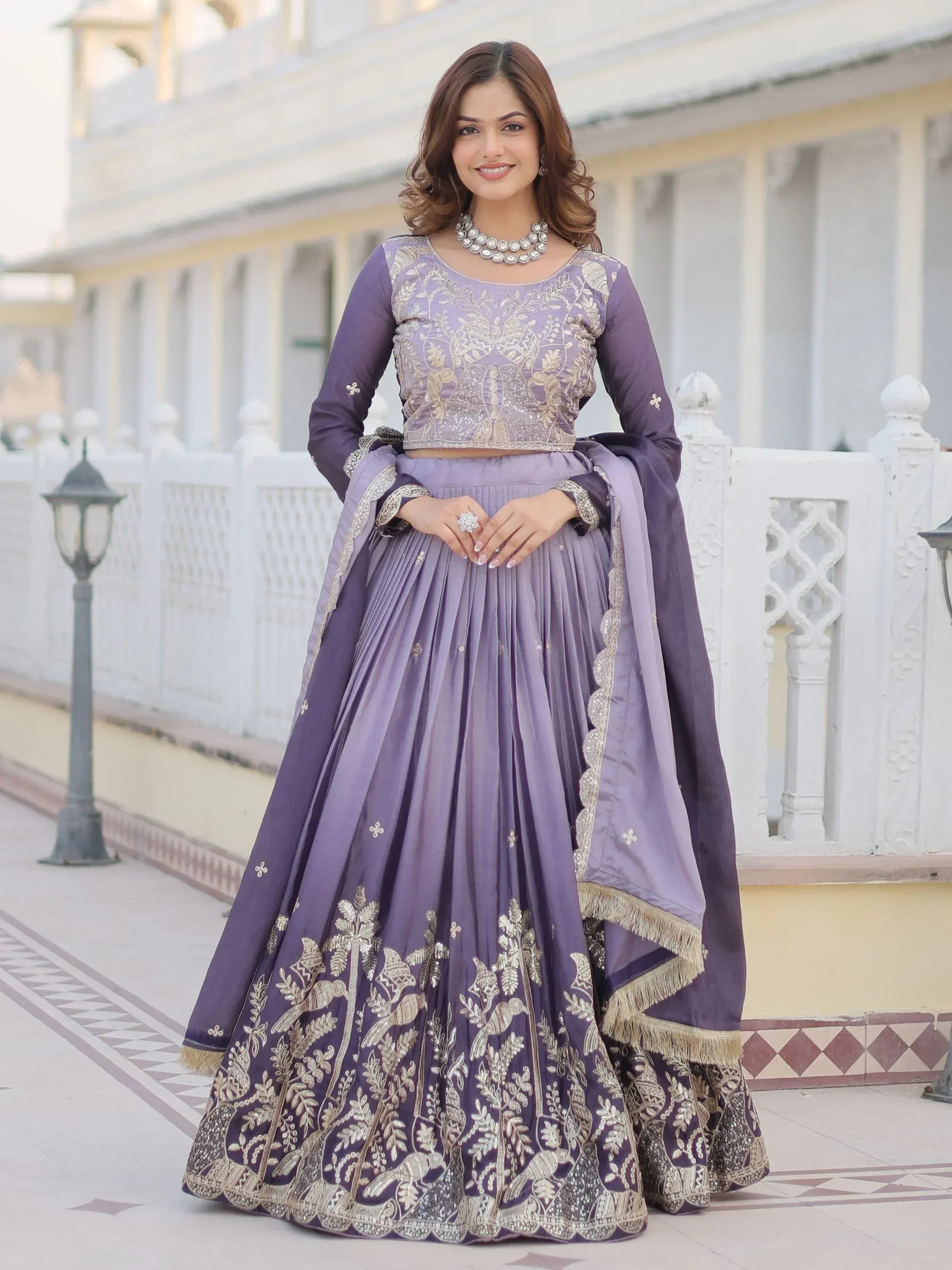 Purple embroidered lehenga choli with gold detailing, perfect for Indian ethnic wear and festive occasions.