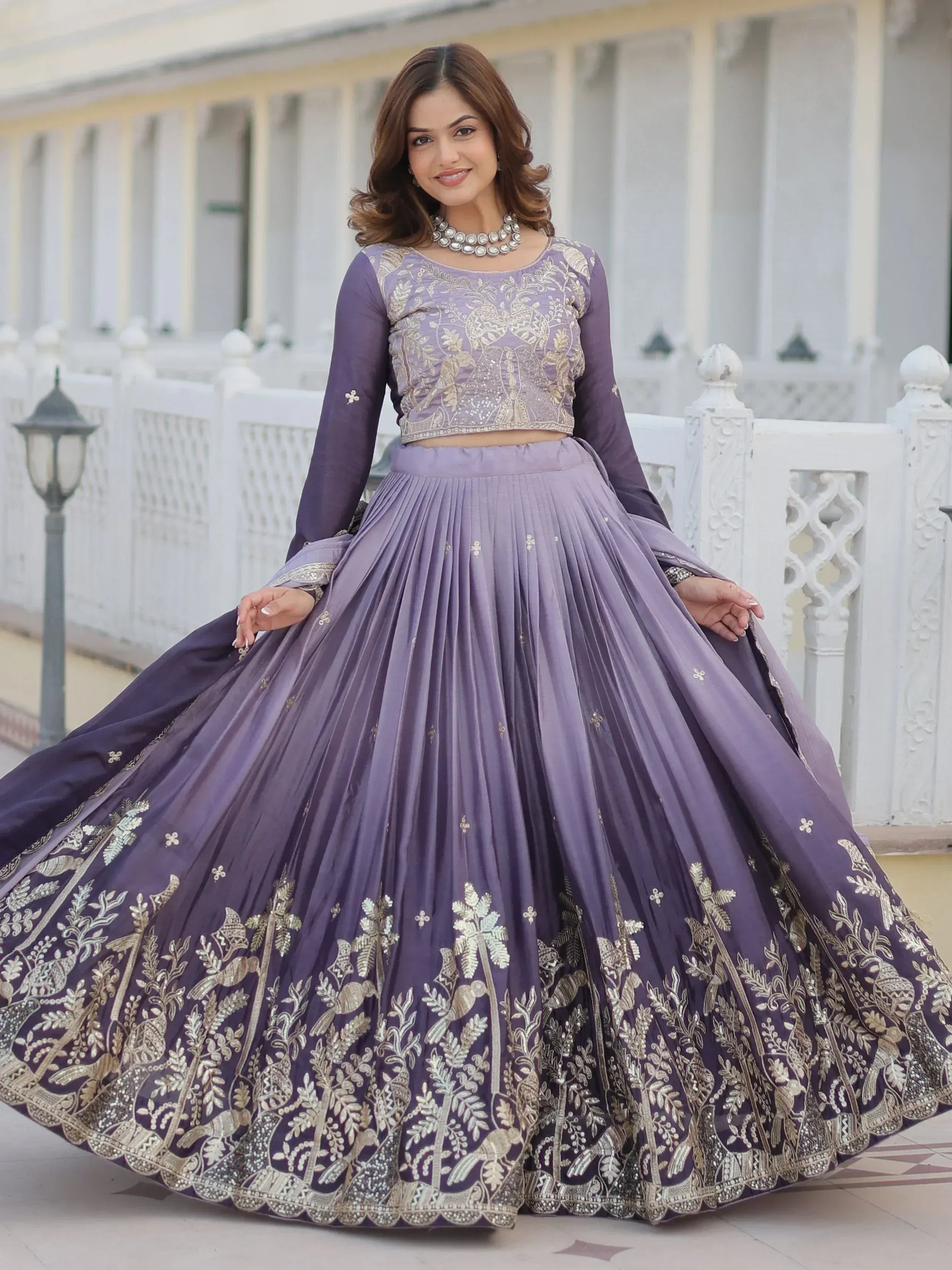 Purple embroidered lehenga choli with gold floral work, perfect for Indian ethnic wear occasions.