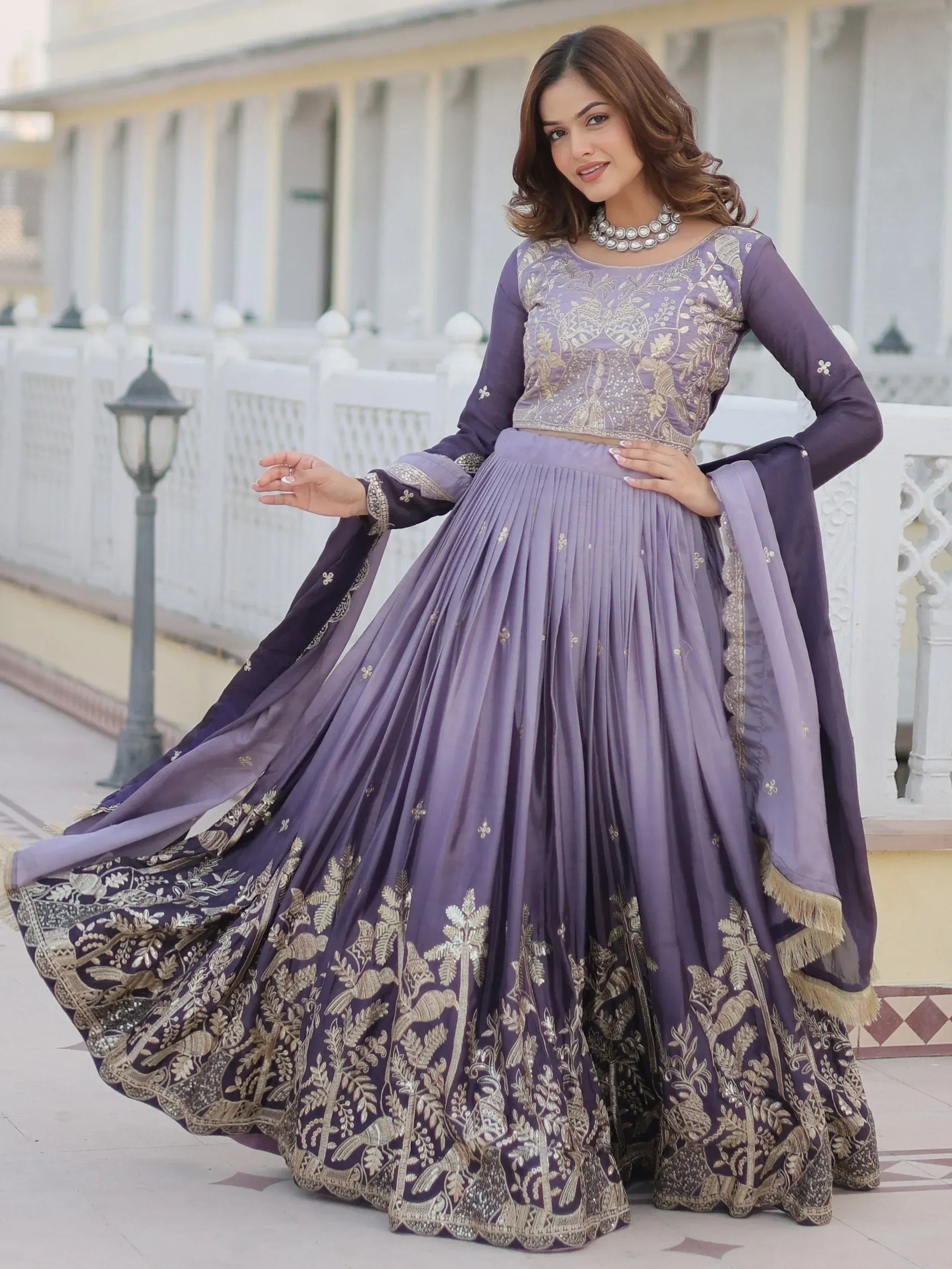 Purple embroidered lehenga choli with gold detailing, perfect for Indian ethnic wear and festive occasions.