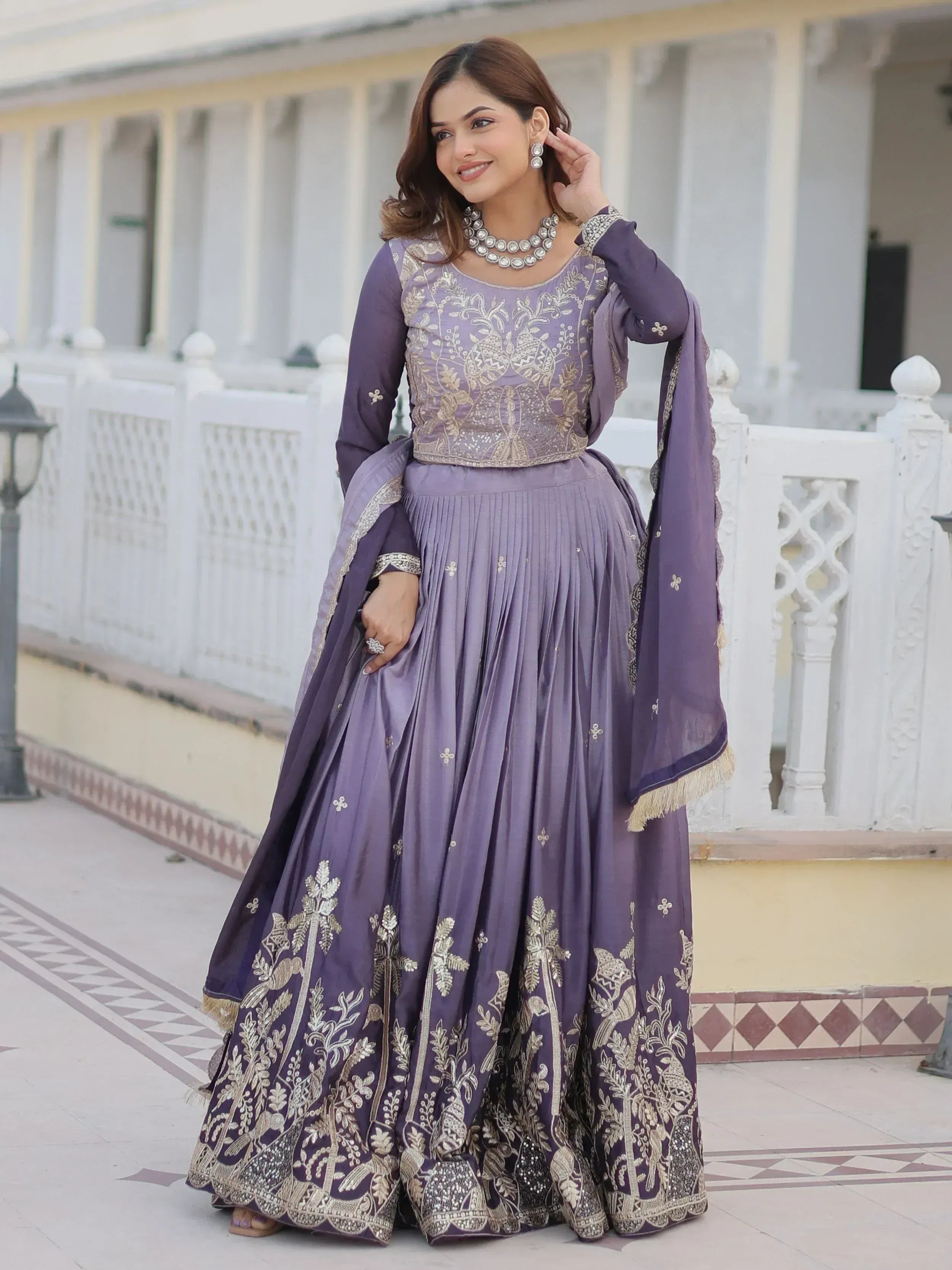 Purple embroidered lehenga choli with gold detailing, perfect for Indian ethnic wear and festive occasions.