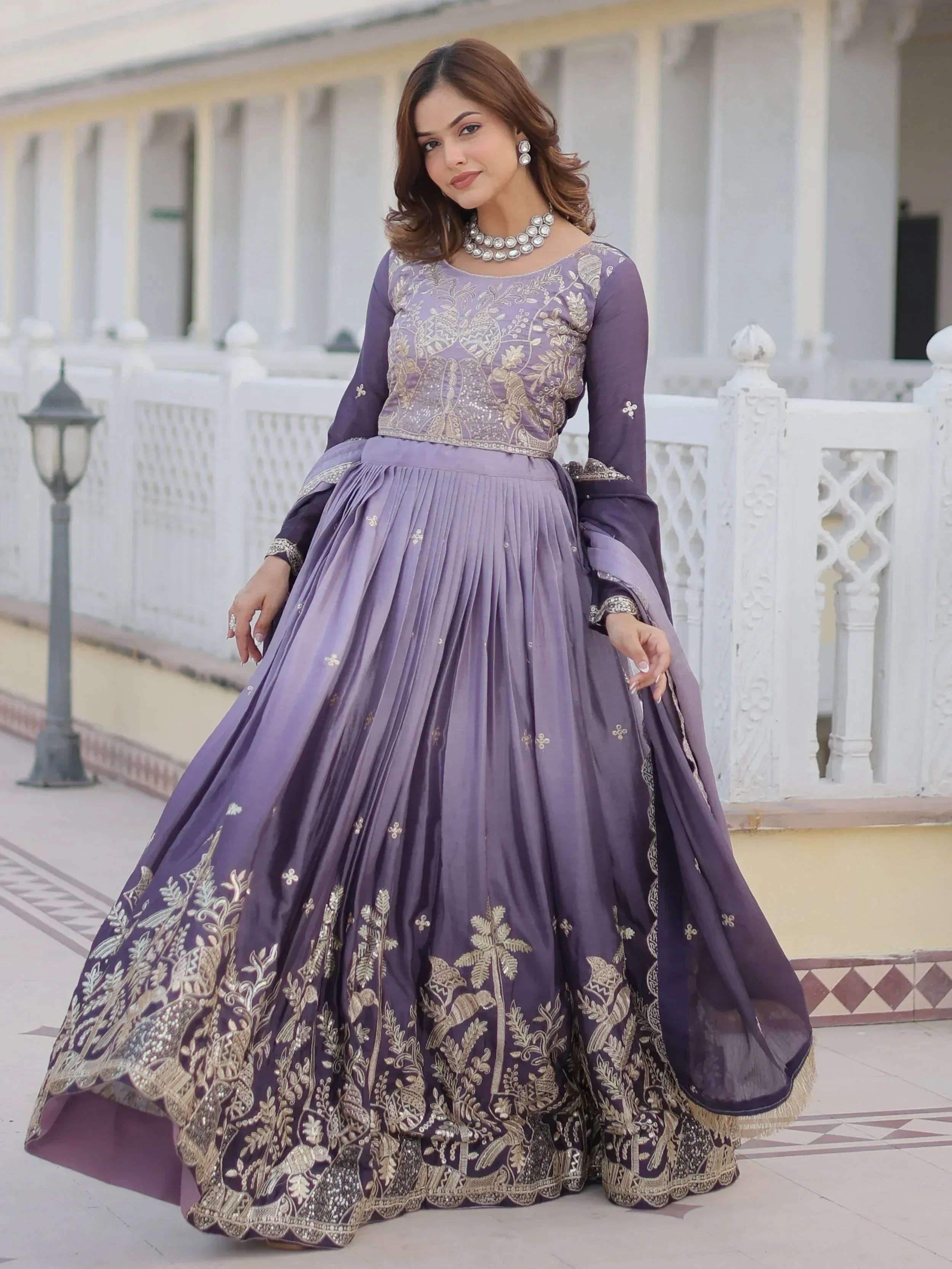 Purple embroidered lehenga choli with gold floral work, perfect for Indian ethnic wear and festive occasions