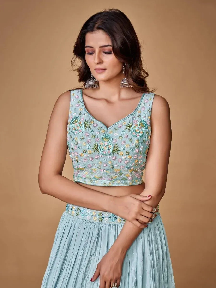 Light blue embroidered lehenga choli with floral motifs, perfect for Indian ethnic wear occasions