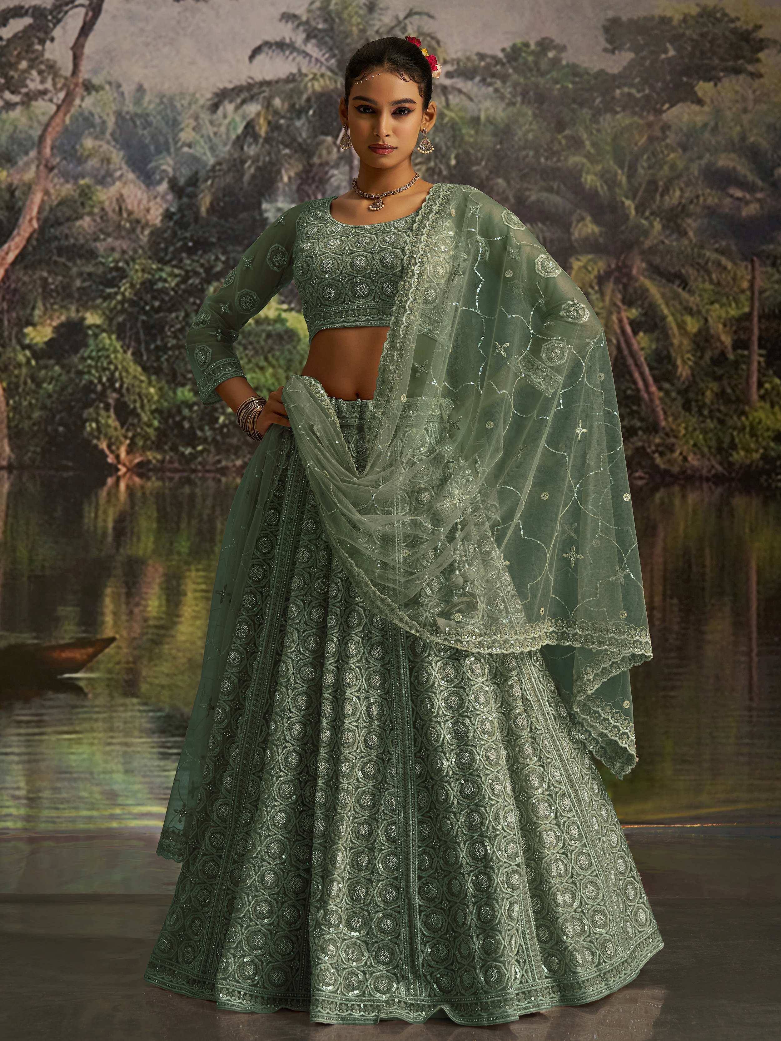 Green embroidered lehenga choli with sheer dupatta, perfect for Indian ethnic occasions