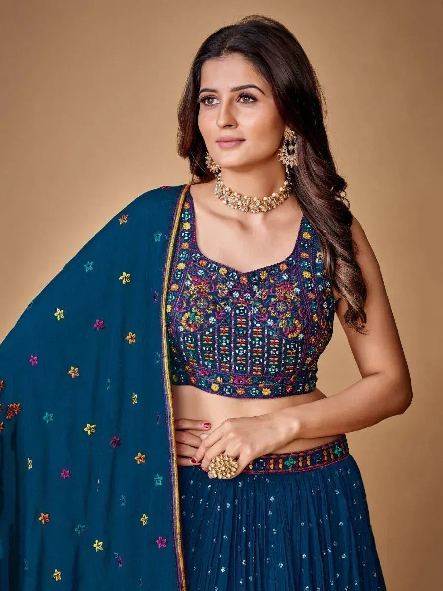 Teal embroidered lehenga choli with floral dupatta, perfect for Indian ethnic occasions
