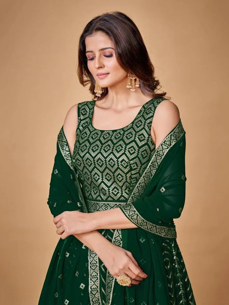Emerald green designer lehenga choli with gold geometric embroidery and cold shoulder sleeves