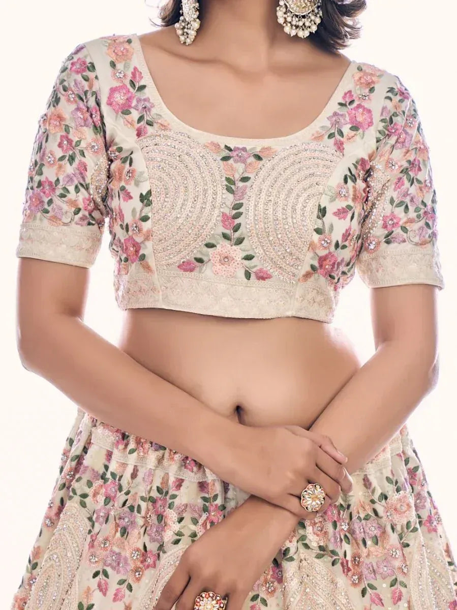 Floral embroidered lehenga choli with pearl embellishments, perfect for Indian ethnic wear occasions