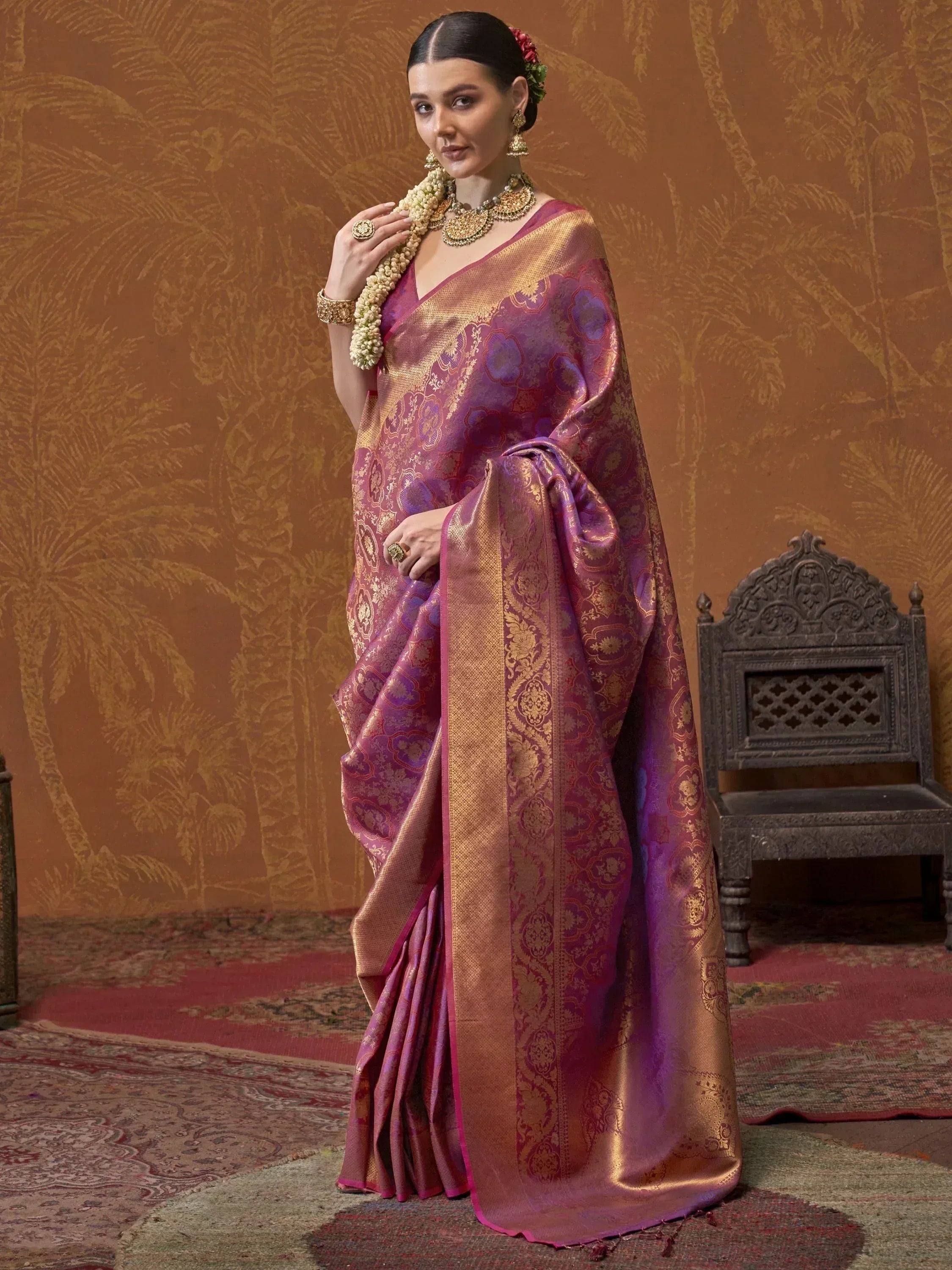 Purple and gold designer saree with intricate floral patterns, traditional Indian ethnic wear