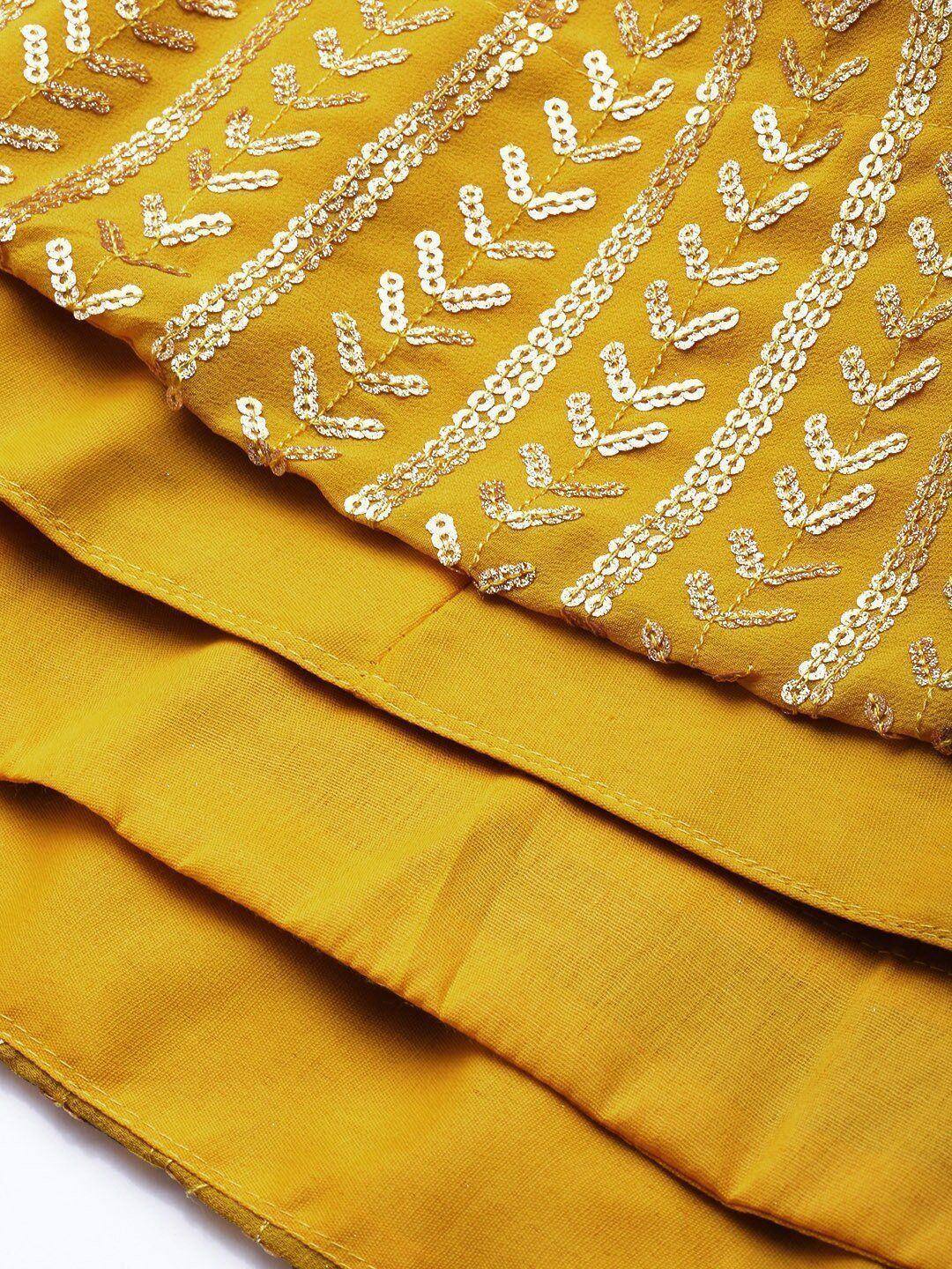 Mustard yellow ethnic gown with gold sequin leaf embroidery, perfect for Indian festive wear