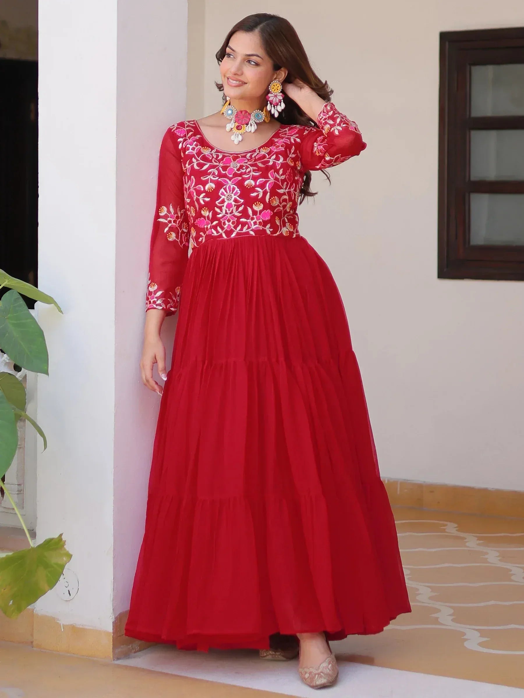 Red embroidered ethnic gown with floral design, perfect for Indian occasions and festive wear.