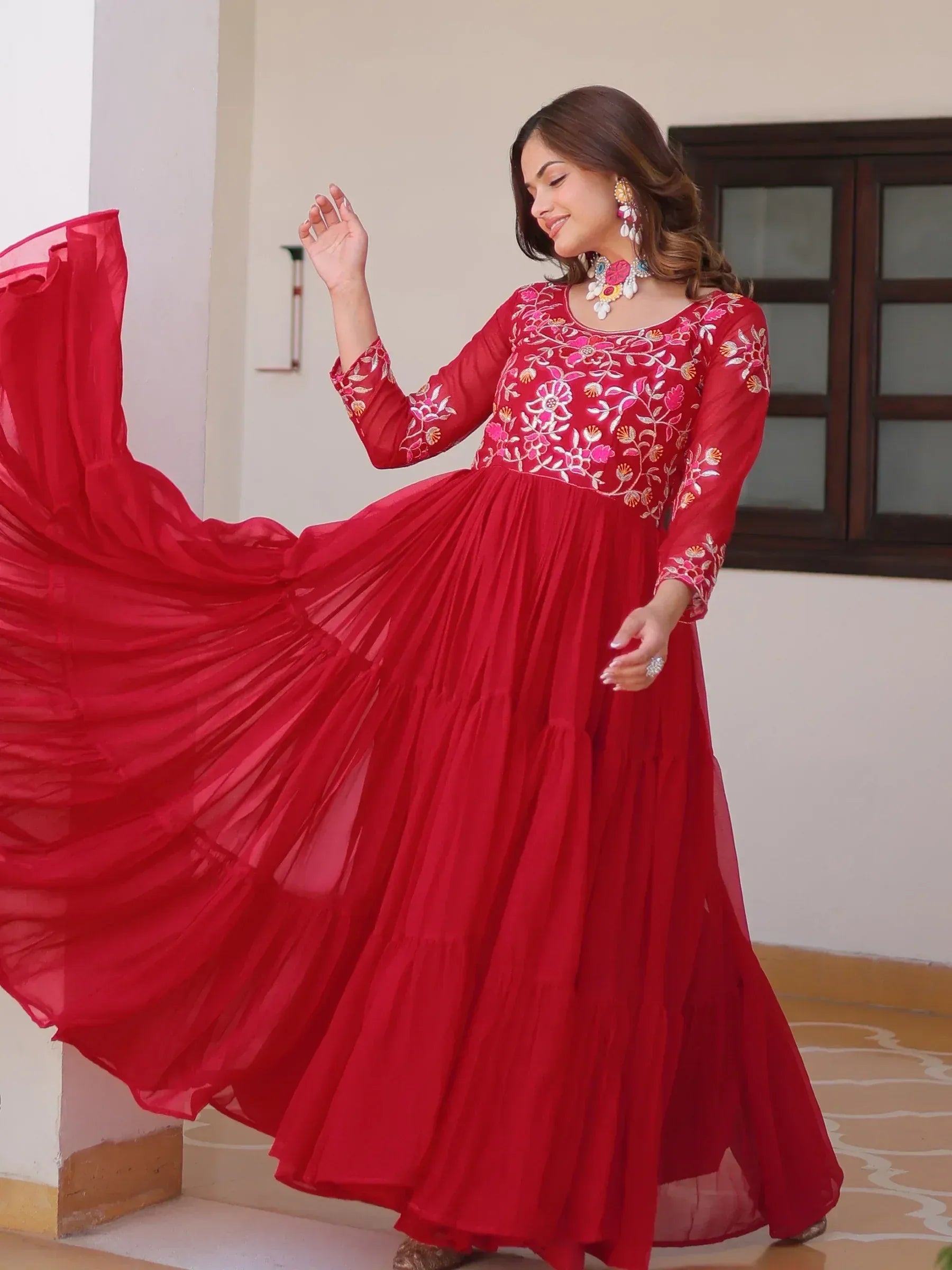 Red embroidered ethnic gown with floral detailing, perfect for Indian occasions and festive wear.