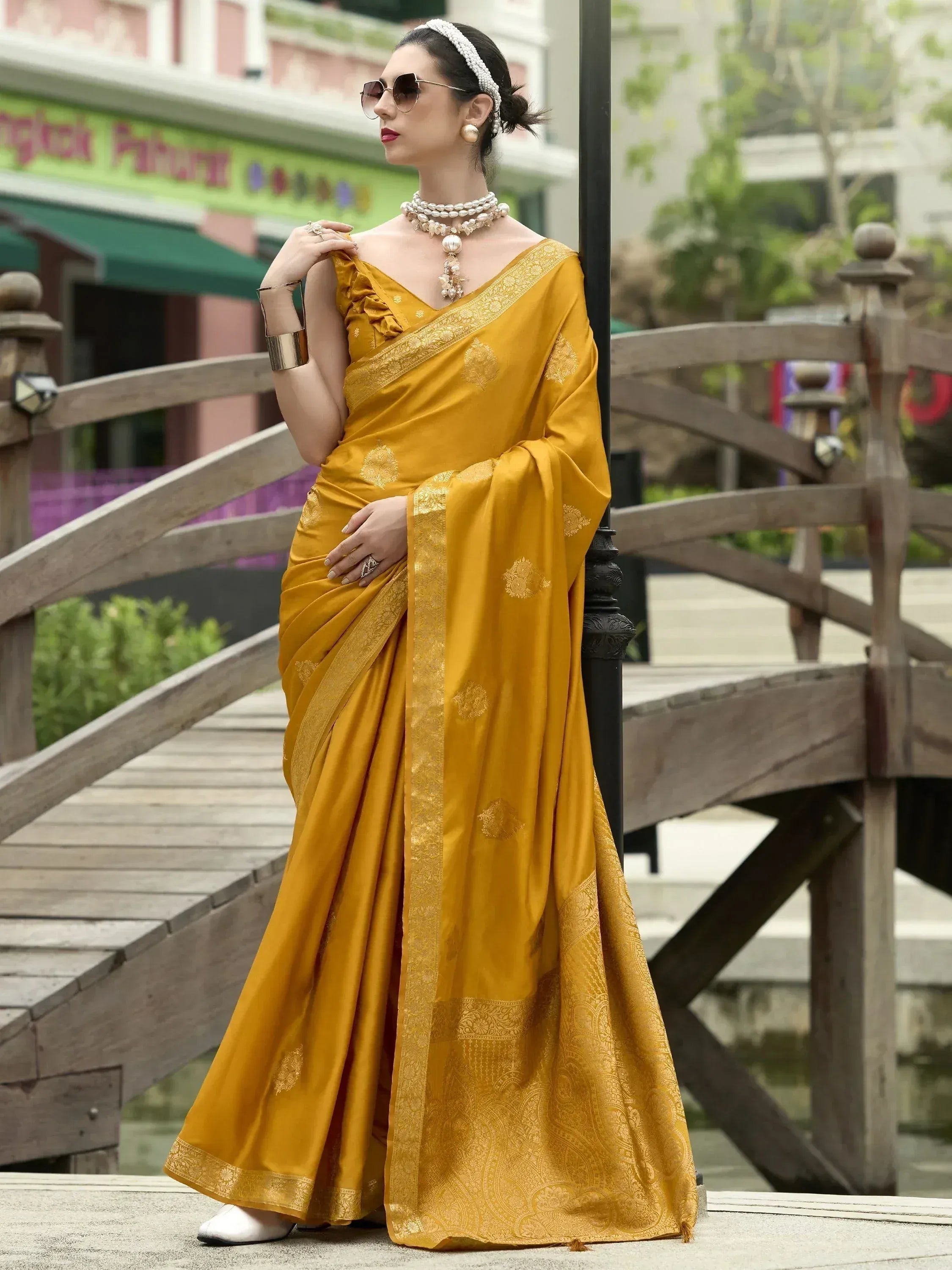 Mustard yellow designer saree with gold embroidery, perfect for ethnic wear and festive occasions.