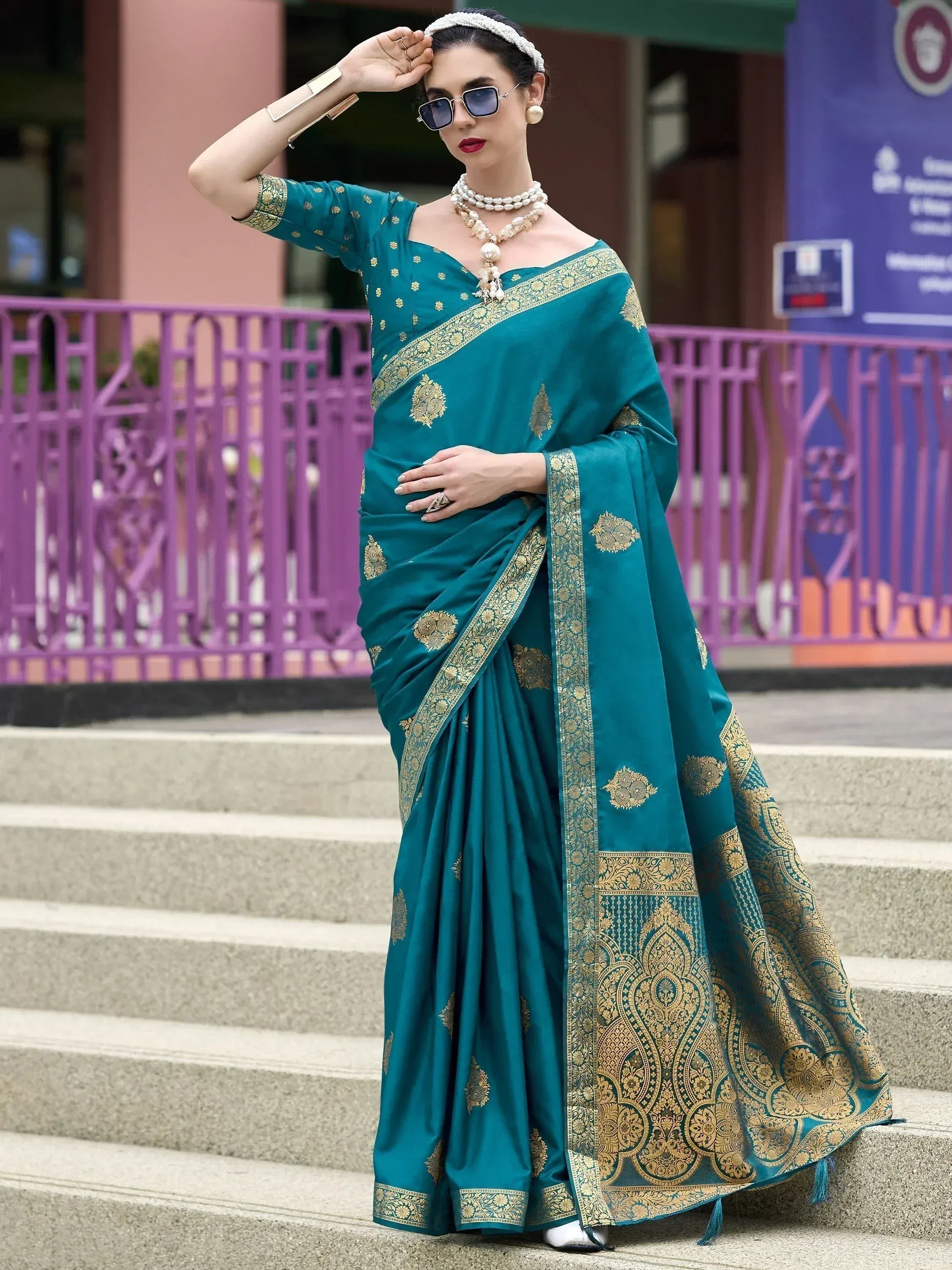 Teal designer saree with gold embroidery, perfect for ethnic occasions and Indian wear